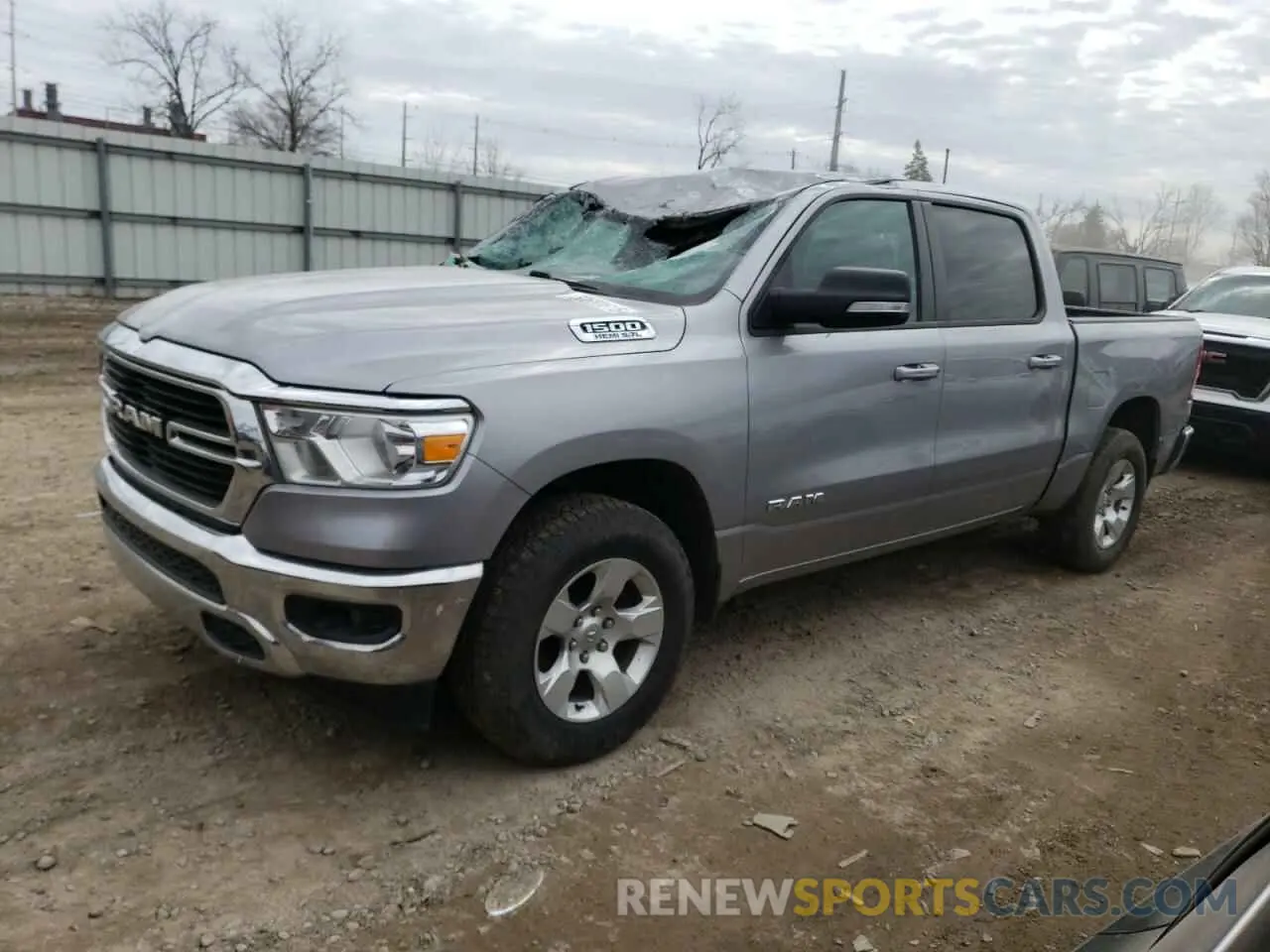 1 Photograph of a damaged car 1C6SRFFT3MN701635 RAM 1500 2021