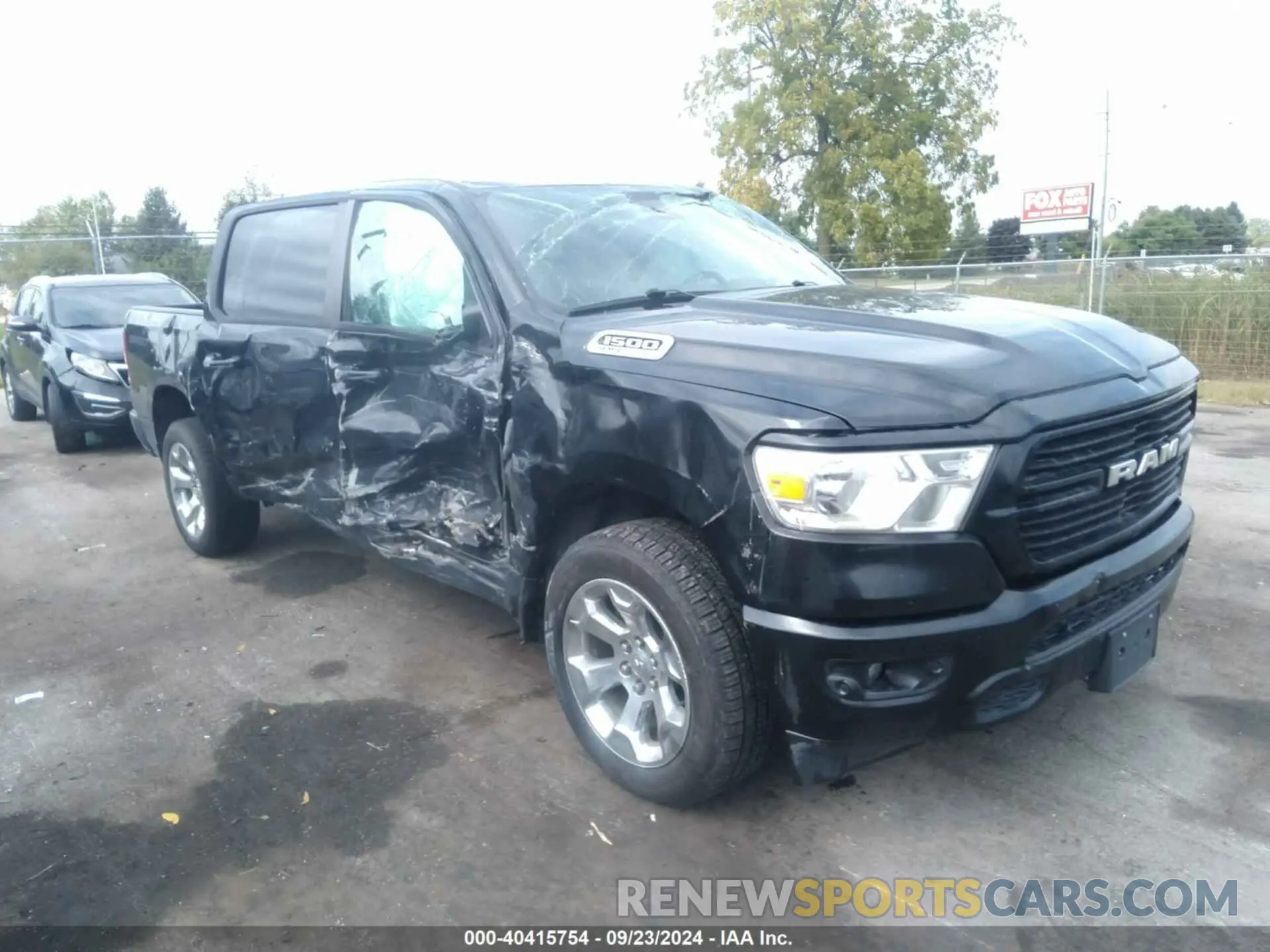1 Photograph of a damaged car 1C6SRFFT5MN778054 RAM 1500 2021