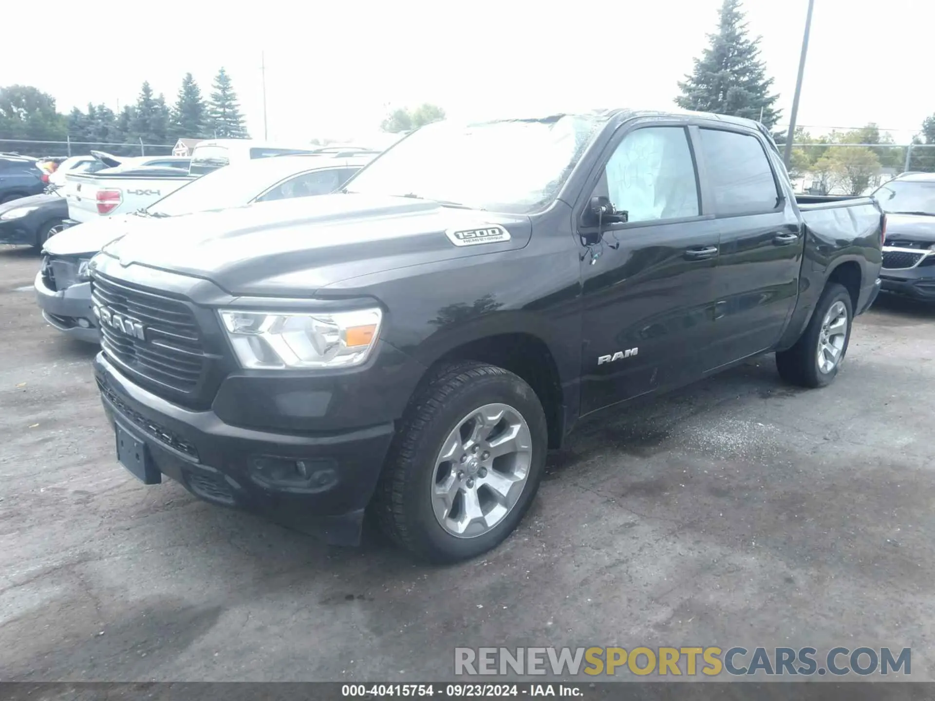 2 Photograph of a damaged car 1C6SRFFT5MN778054 RAM 1500 2021