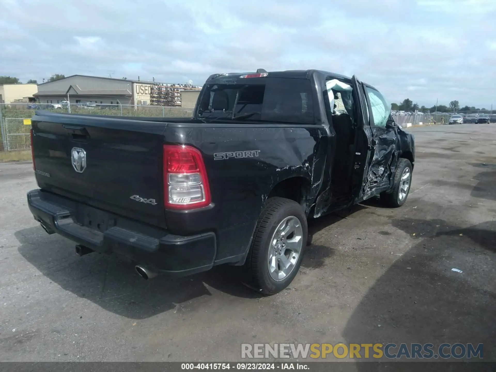 4 Photograph of a damaged car 1C6SRFFT5MN778054 RAM 1500 2021