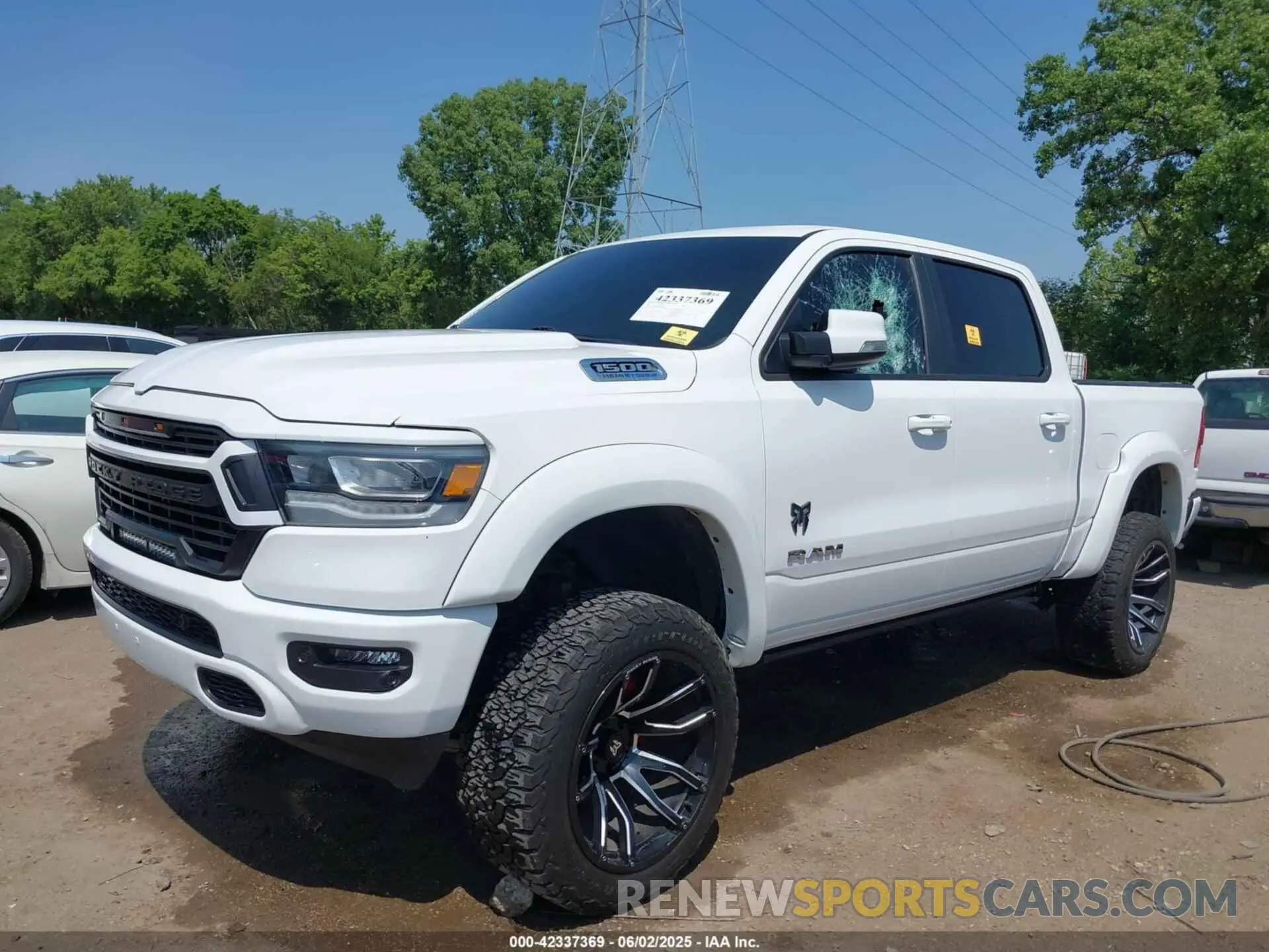 2 Photograph of a damaged car 1C6SRFFT6MN785594 RAM 1500 2021