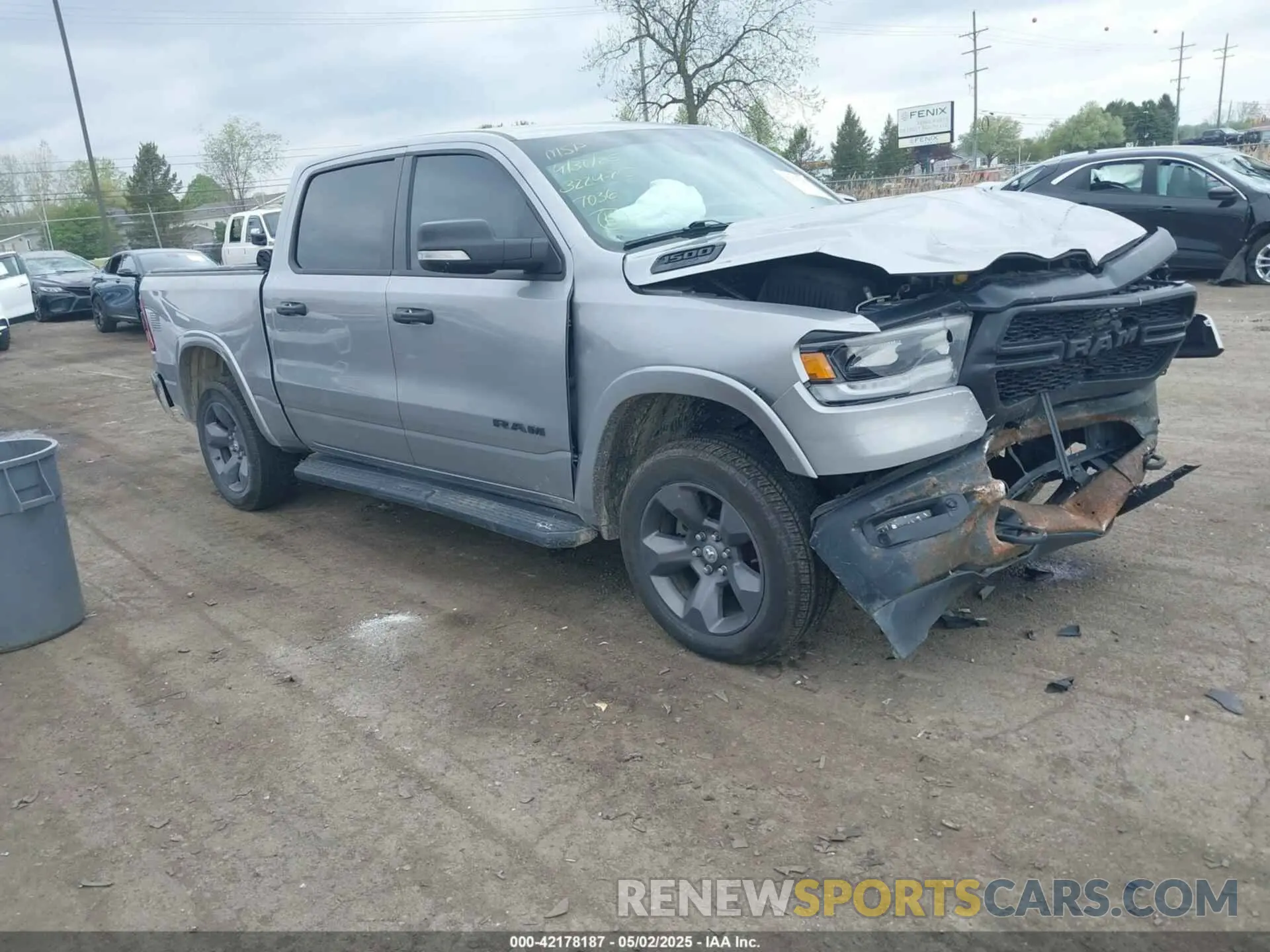 1 Photograph of a damaged car 1C6SRFFT7MN597036 RAM 1500 2021