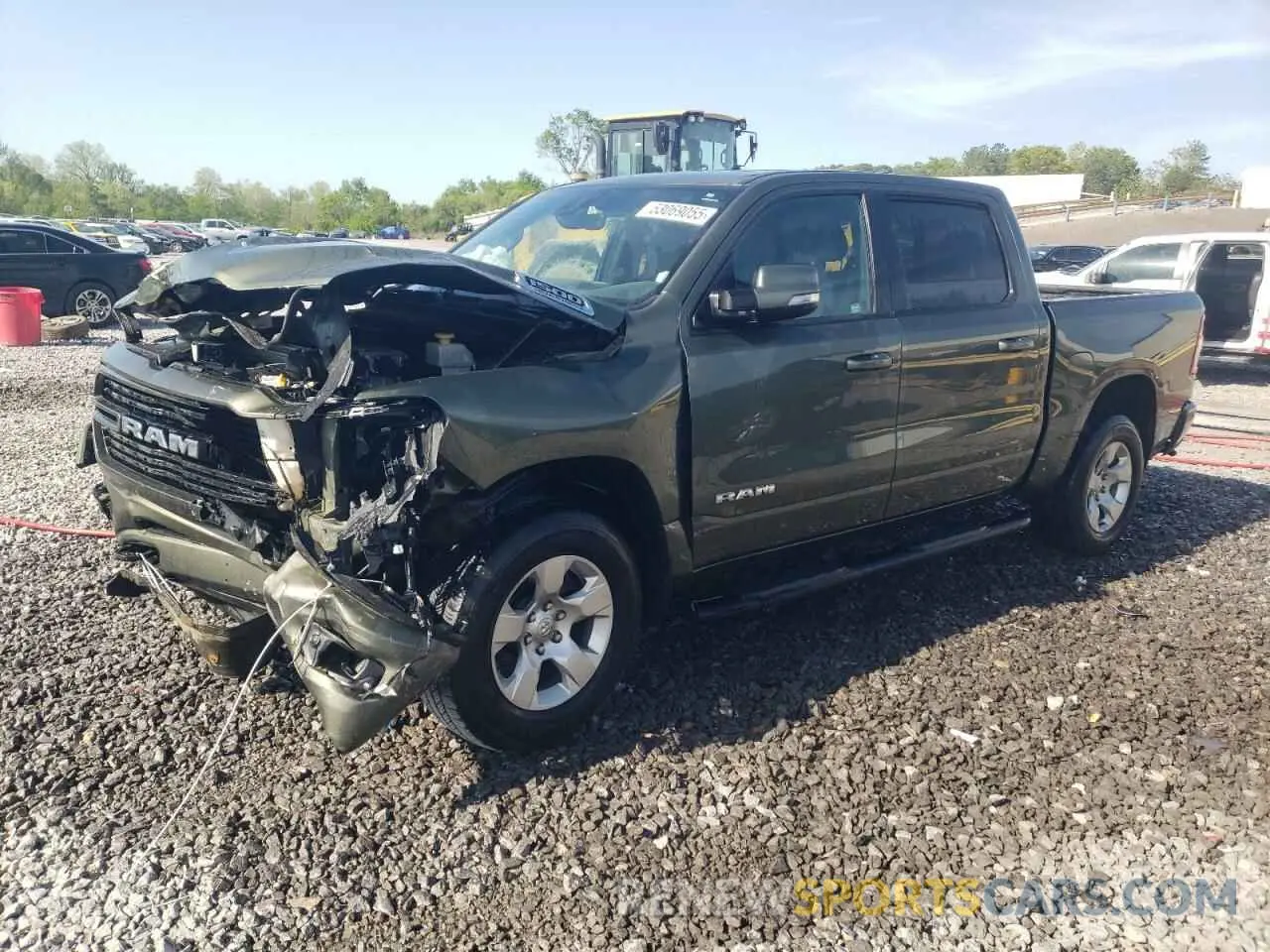 1 Photograph of a damaged car 1C6SRFFT8MN504931 RAM 1500 2021