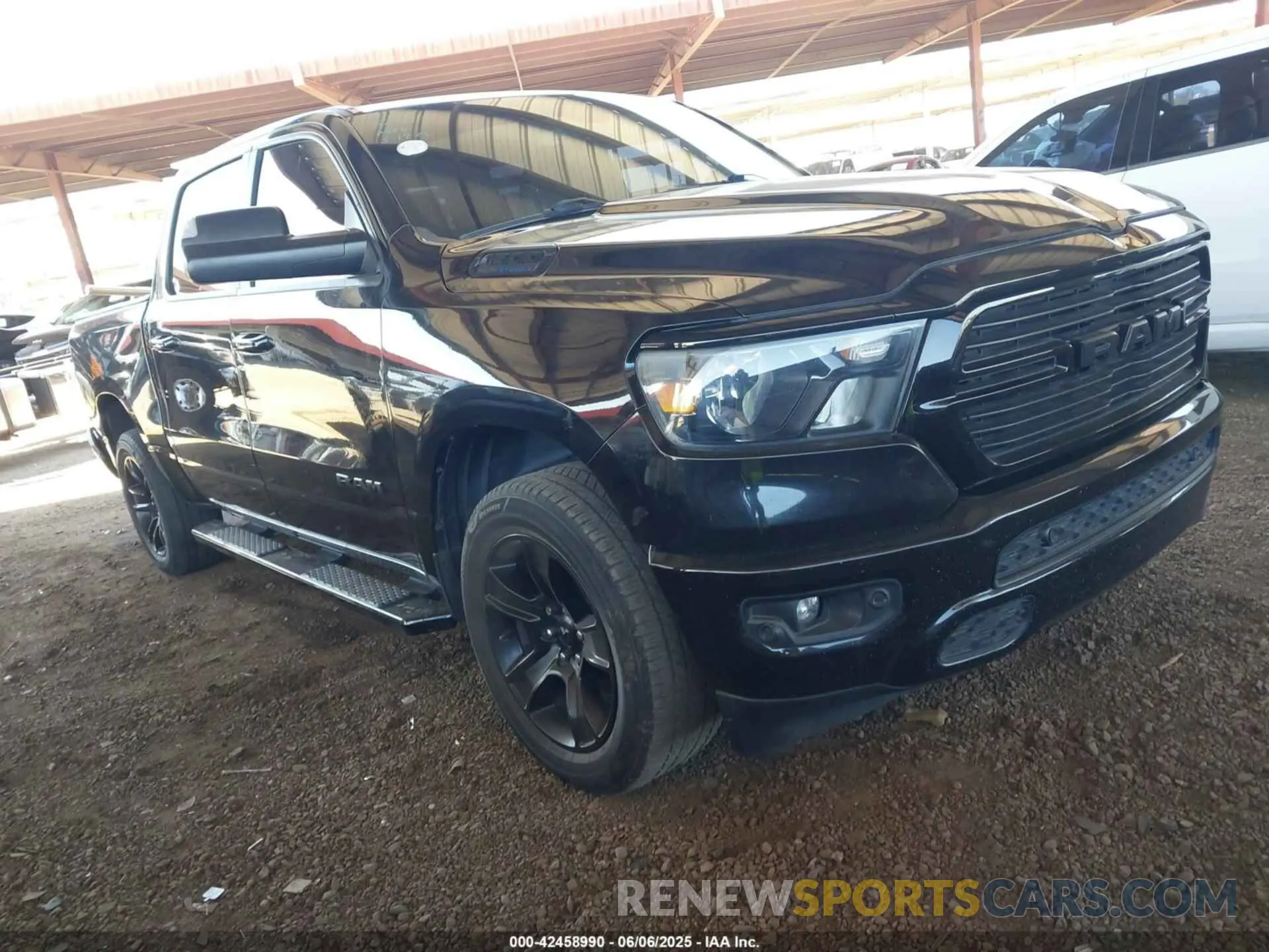 1 Photograph of a damaged car 1C6SRFFT8MN658975 RAM 1500 2021