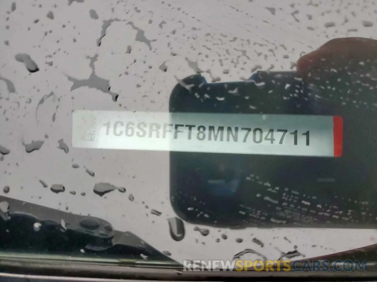 12 Photograph of a damaged car 1C6SRFFT8MN704711 RAM 1500 2021