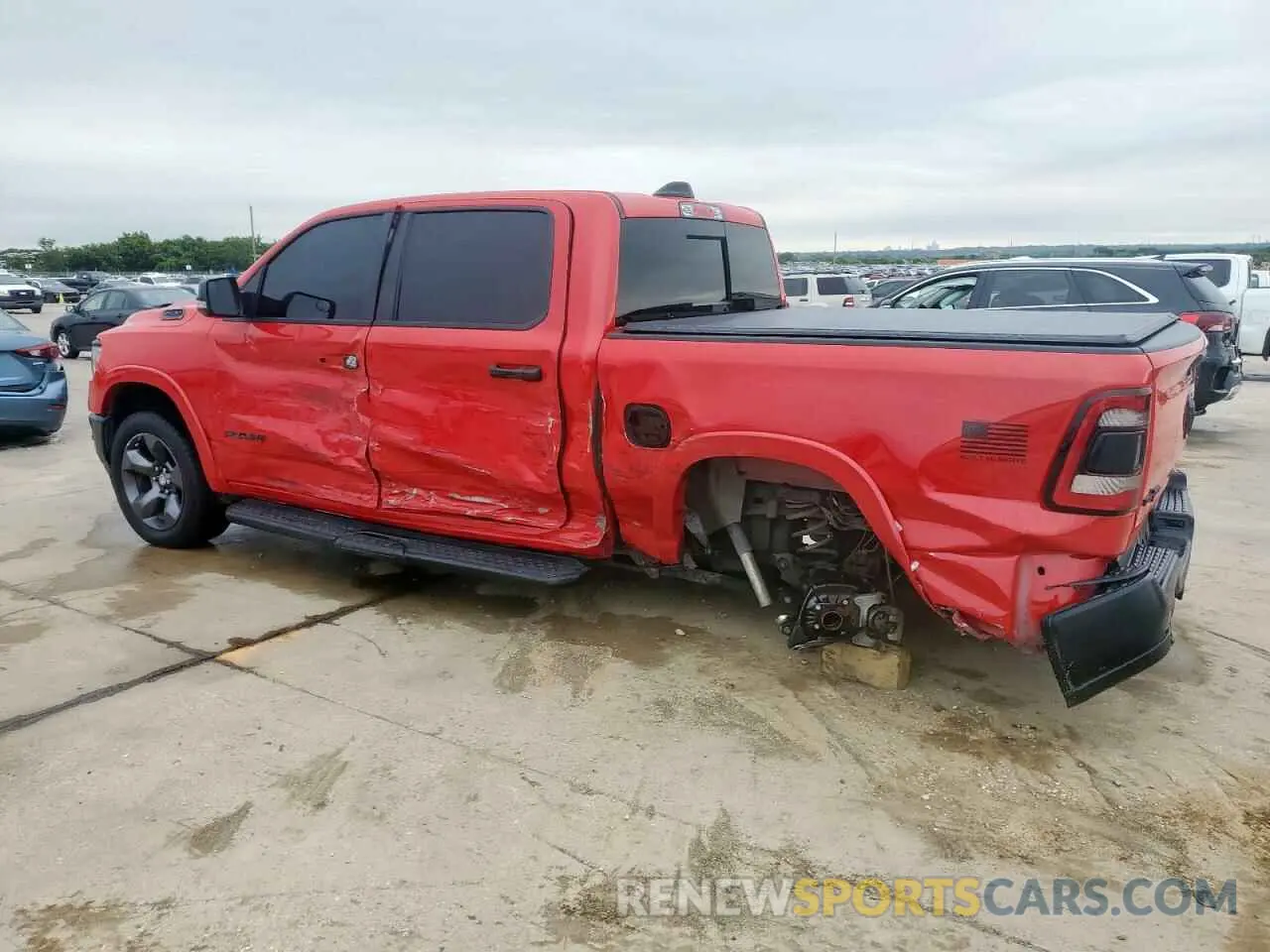 2 Photograph of a damaged car 1C6SRFFT8MN704711 RAM 1500 2021