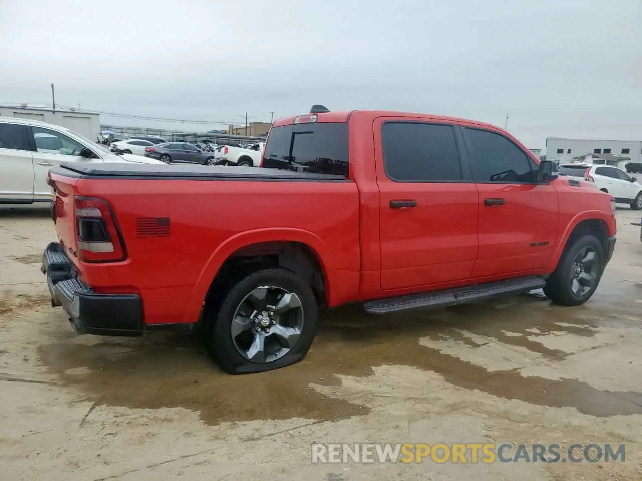 3 Photograph of a damaged car 1C6SRFFT8MN704711 RAM 1500 2021