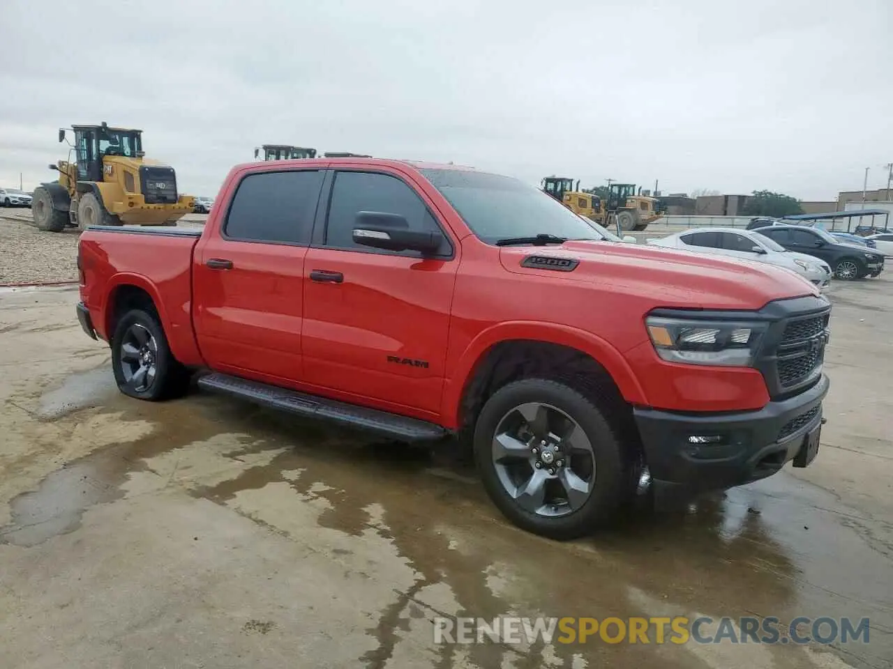4 Photograph of a damaged car 1C6SRFFT8MN704711 RAM 1500 2021