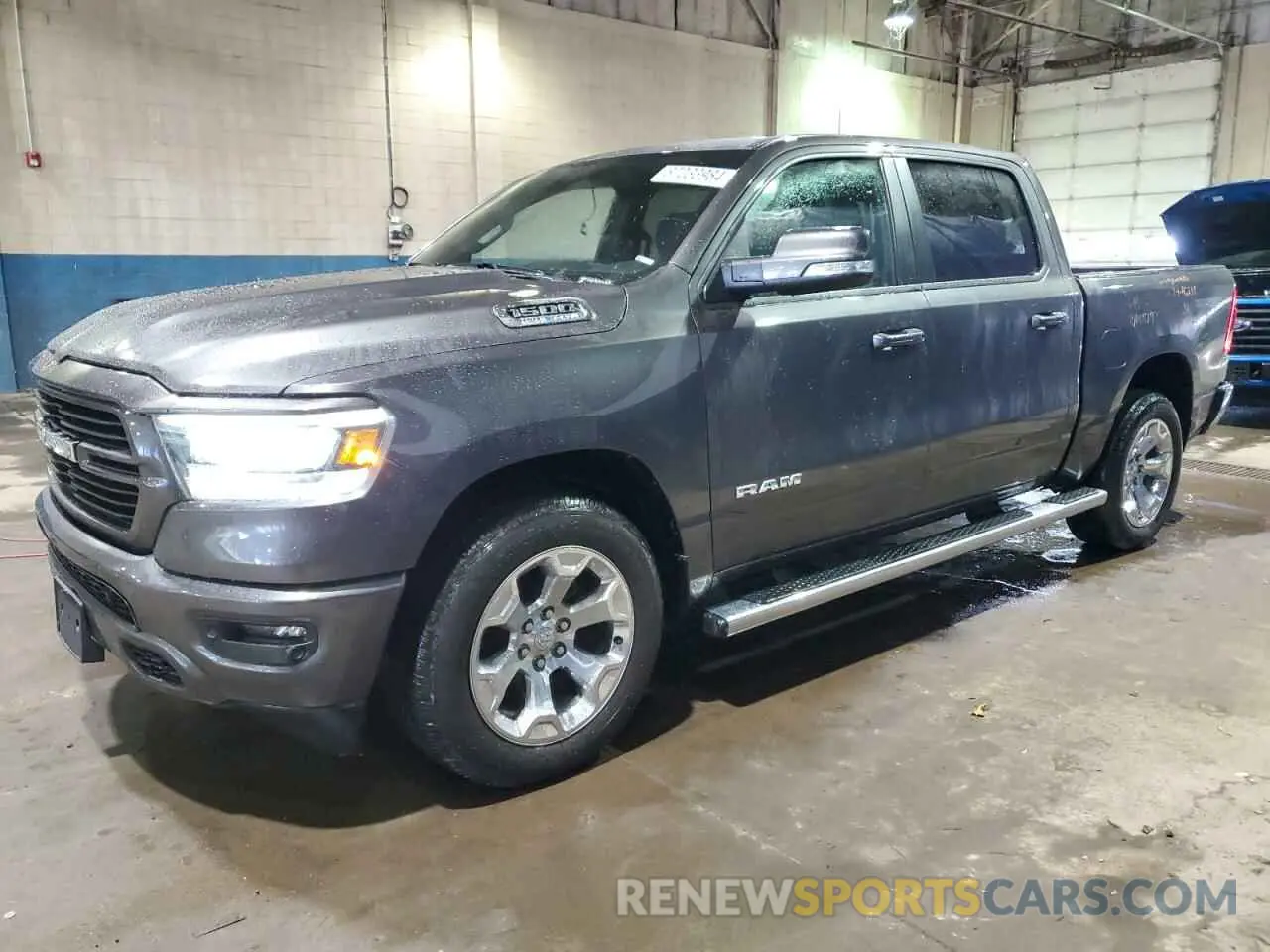 1 Photograph of a damaged car 1C6SRFFT9MN647970 RAM 1500 2021