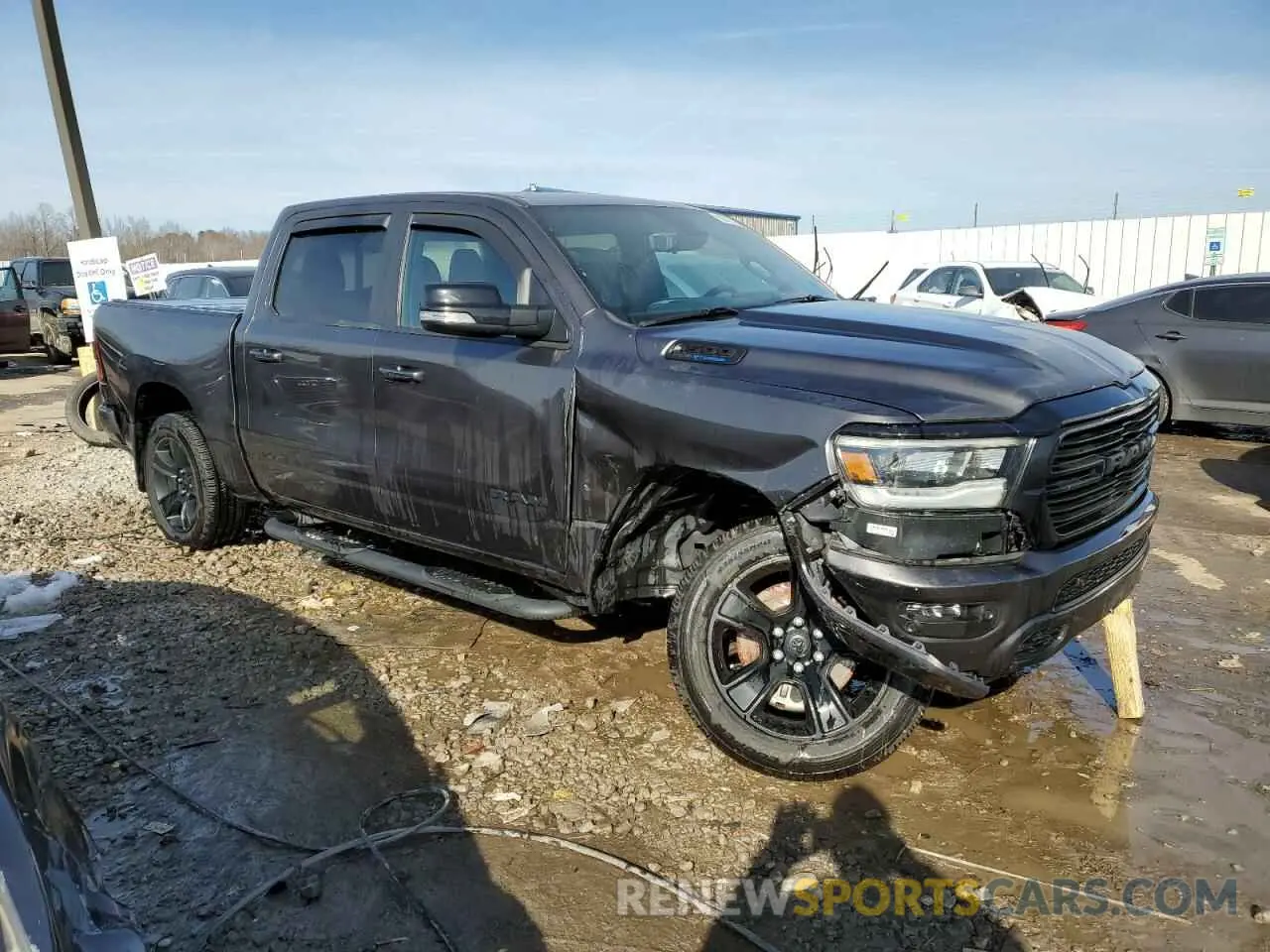 4 Photograph of a damaged car 1C6SRFFT9MN674134 RAM 1500 2021