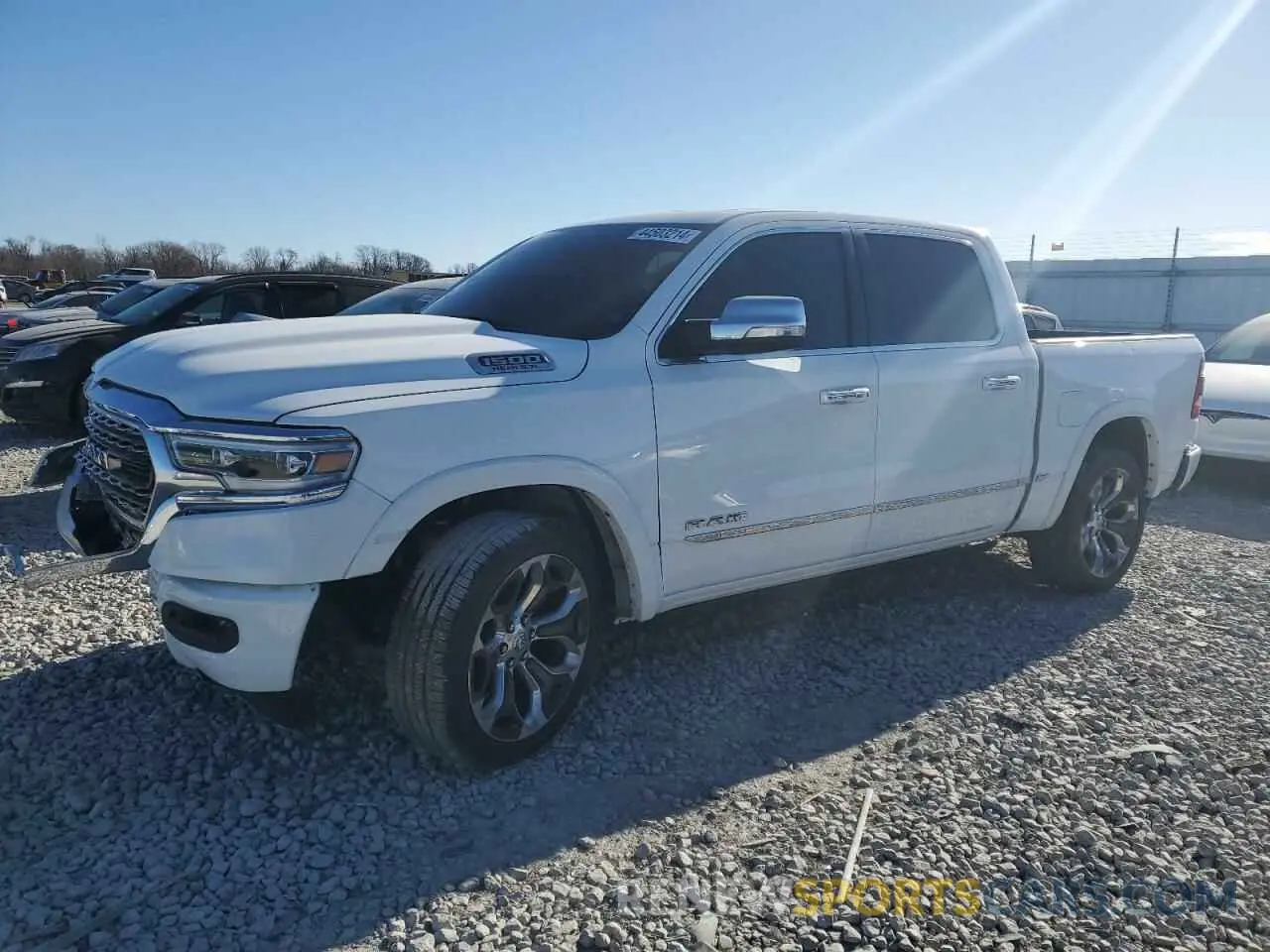 1 Photograph of a damaged car 1C6SRFHT1MN831295 RAM 1500 2021
