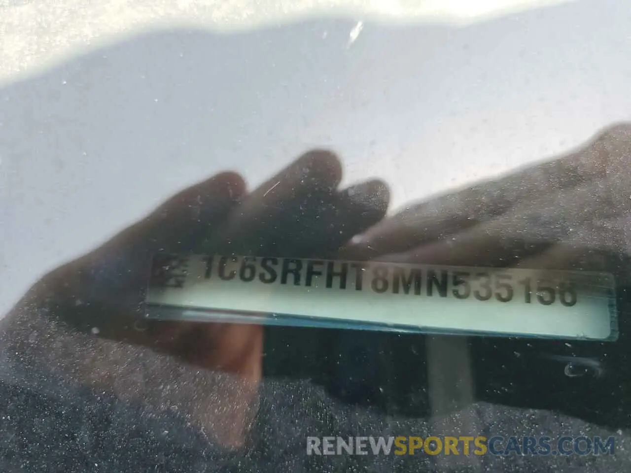 12 Photograph of a damaged car 1C6SRFHT8MN535156 RAM 1500 2021