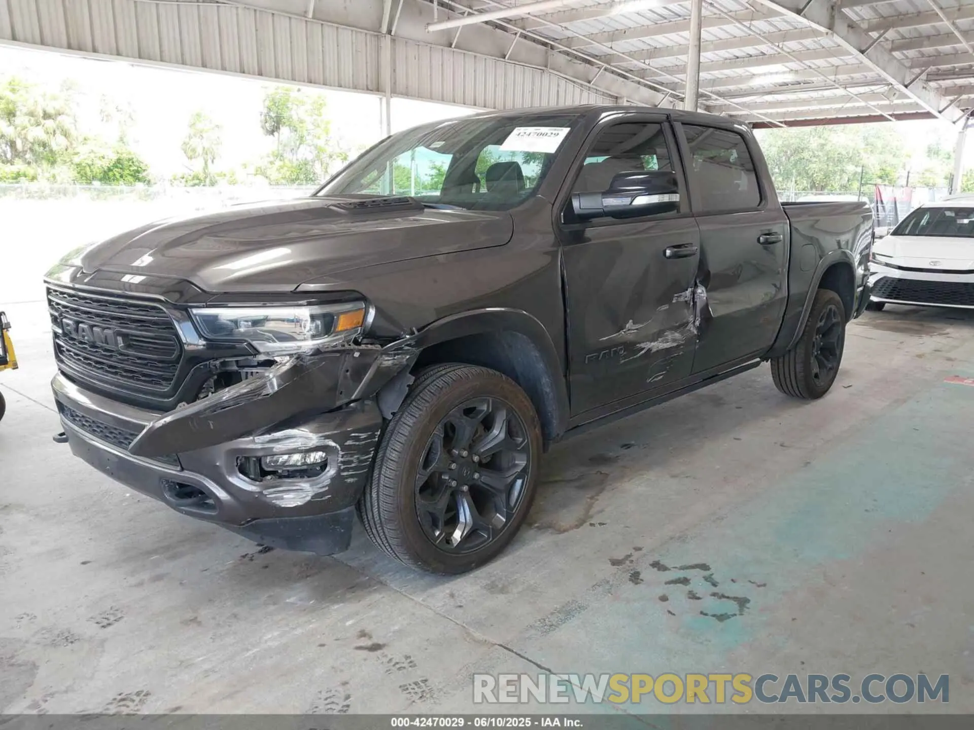 2 Photograph of a damaged car 1C6SRFHTXMN536566 RAM 1500 2021