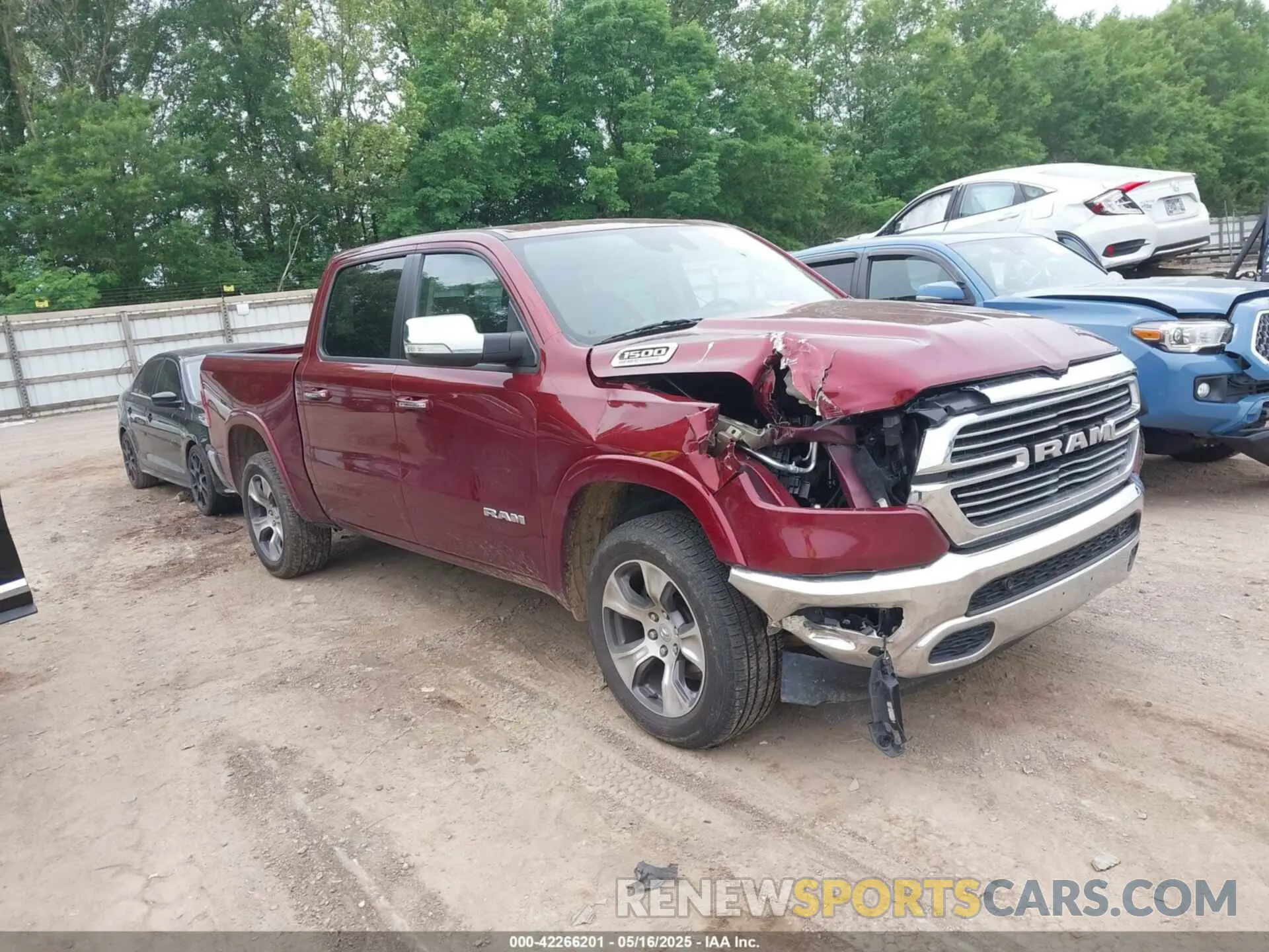 1 Photograph of a damaged car 1C6SRFJT0MN784724 RAM 1500 2021