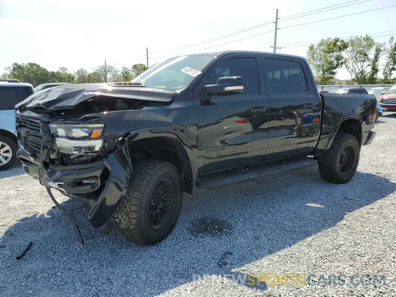 1 Photograph of a damaged car 1C6SRFJT1MN823126 RAM 1500 2021