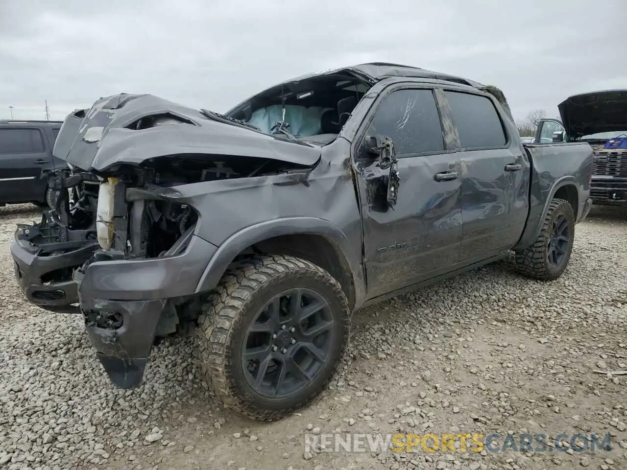 1 Photograph of a damaged car 1C6SRFJT8MN558866 RAM 1500 2021