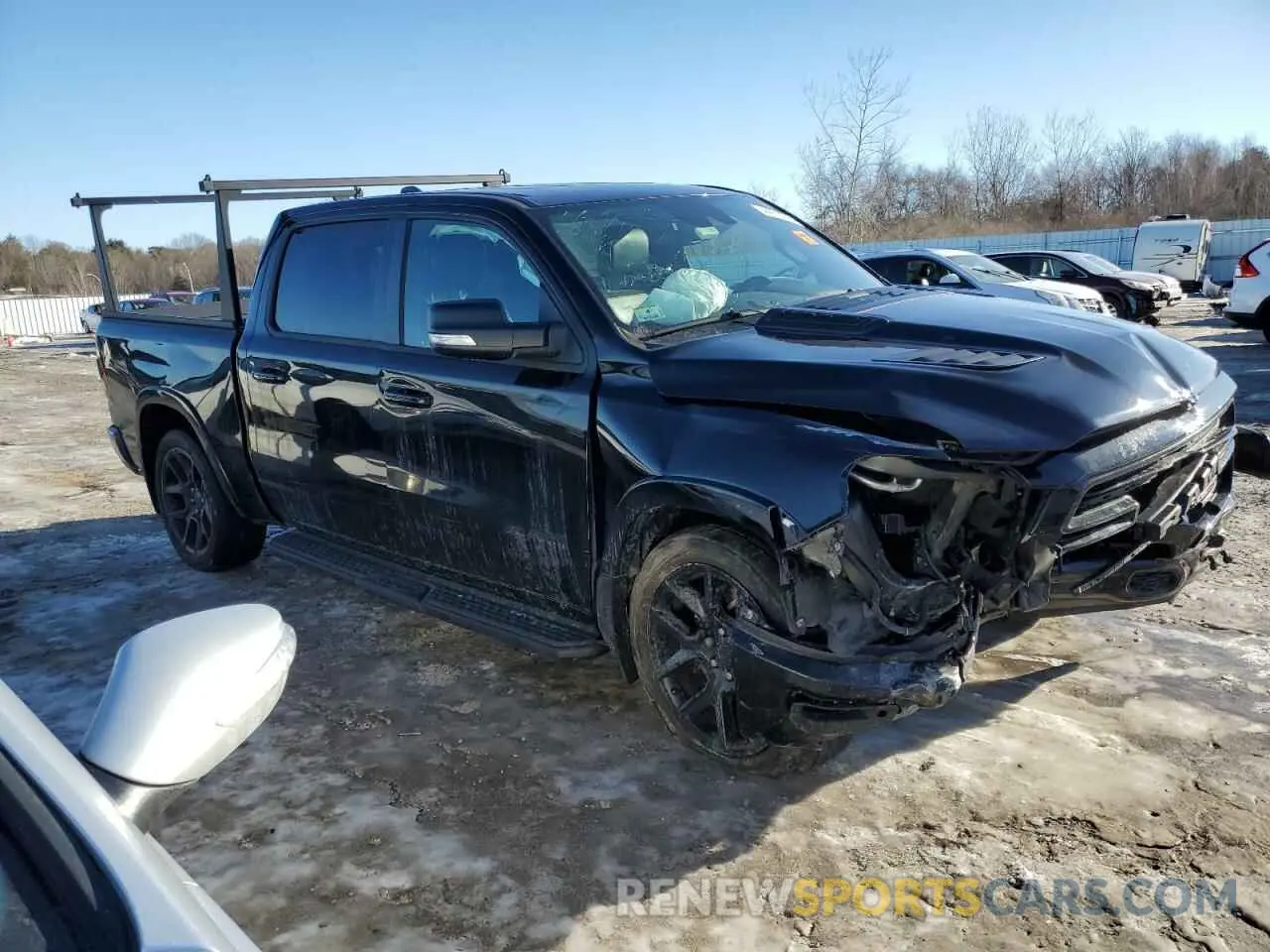 4 Photograph of a damaged car 1C6SRFJTXMN577760 RAM 1500 2021