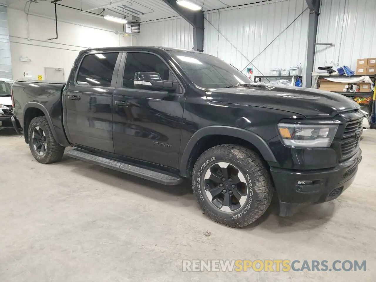 4 Photograph of a damaged car 1C6SRFJTXMN634443 RAM 1500 2021