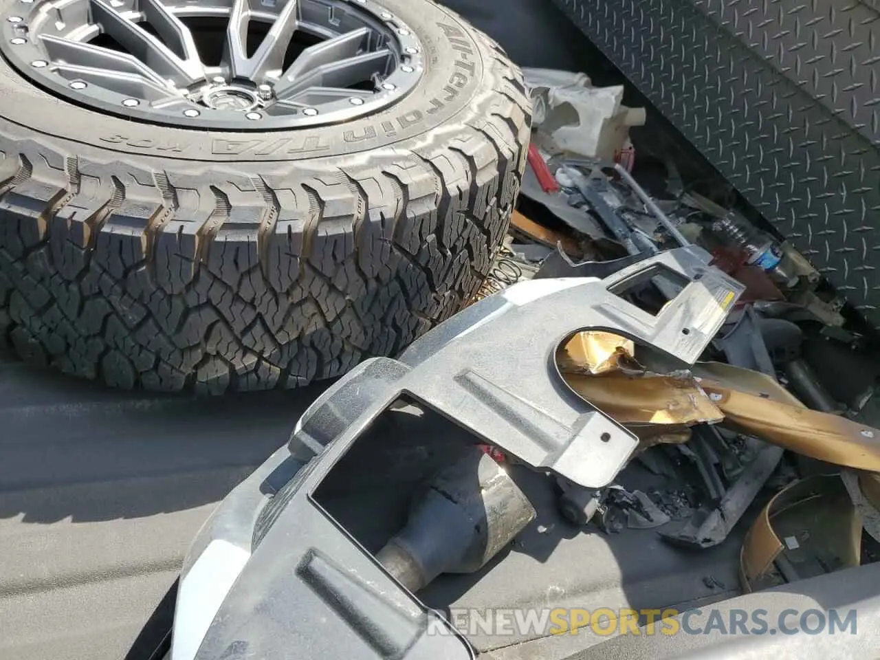 14 Photograph of a damaged car 1C6SRFLT0MN559961 RAM 1500 2021
