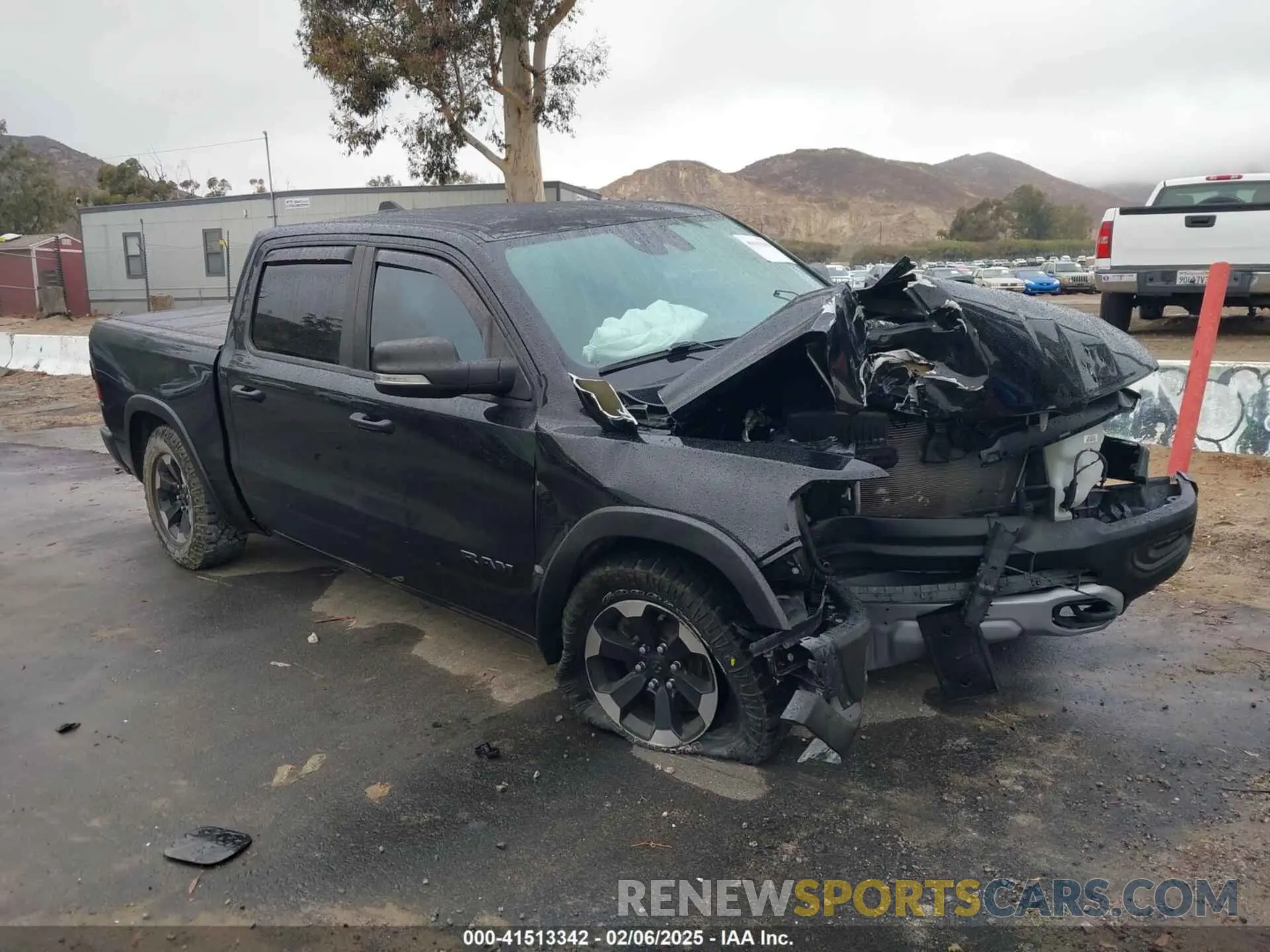 1 Photograph of a damaged car 1C6SRFLT0MN614070 RAM 1500 2021