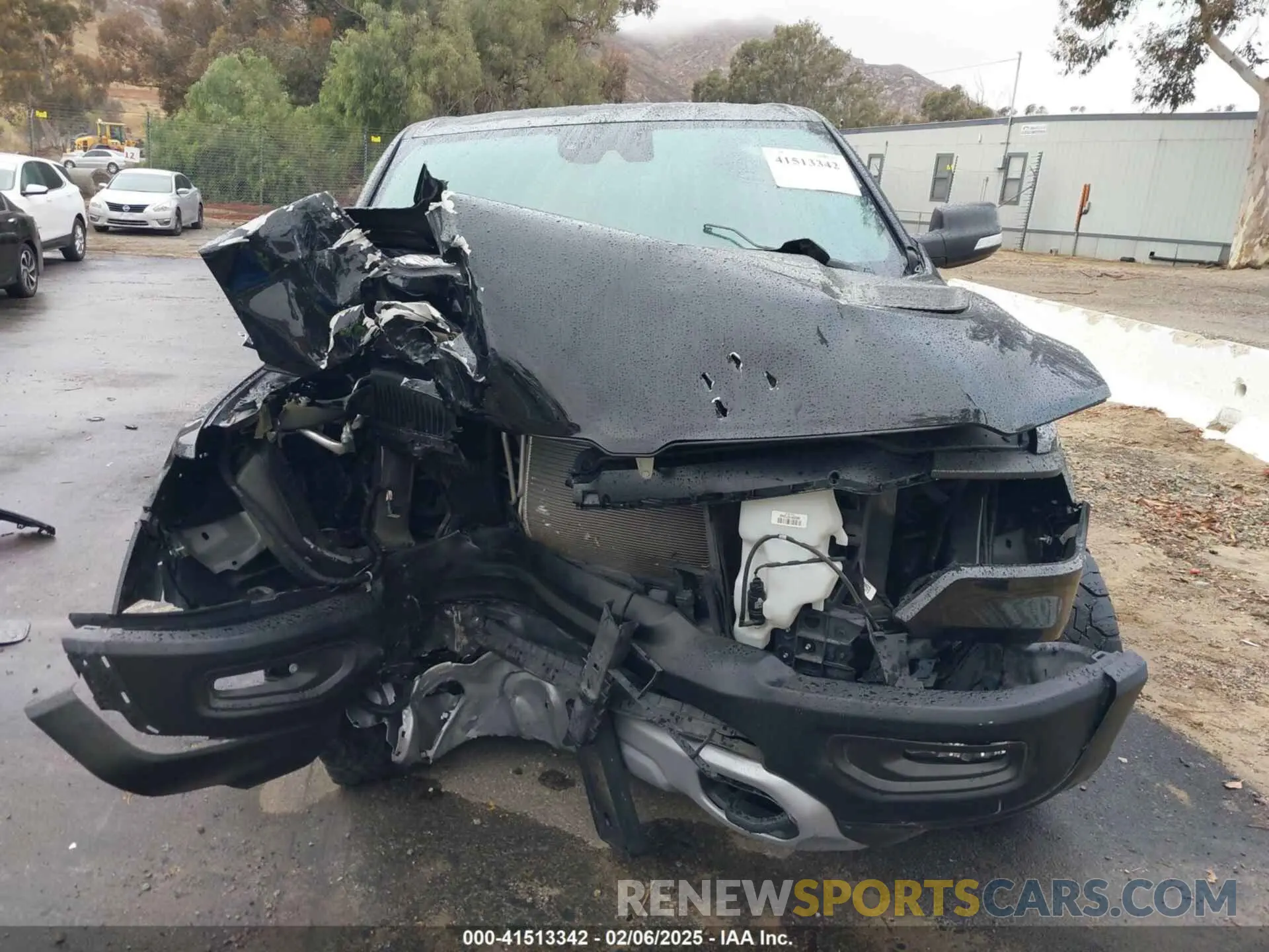 13 Photograph of a damaged car 1C6SRFLT0MN614070 RAM 1500 2021