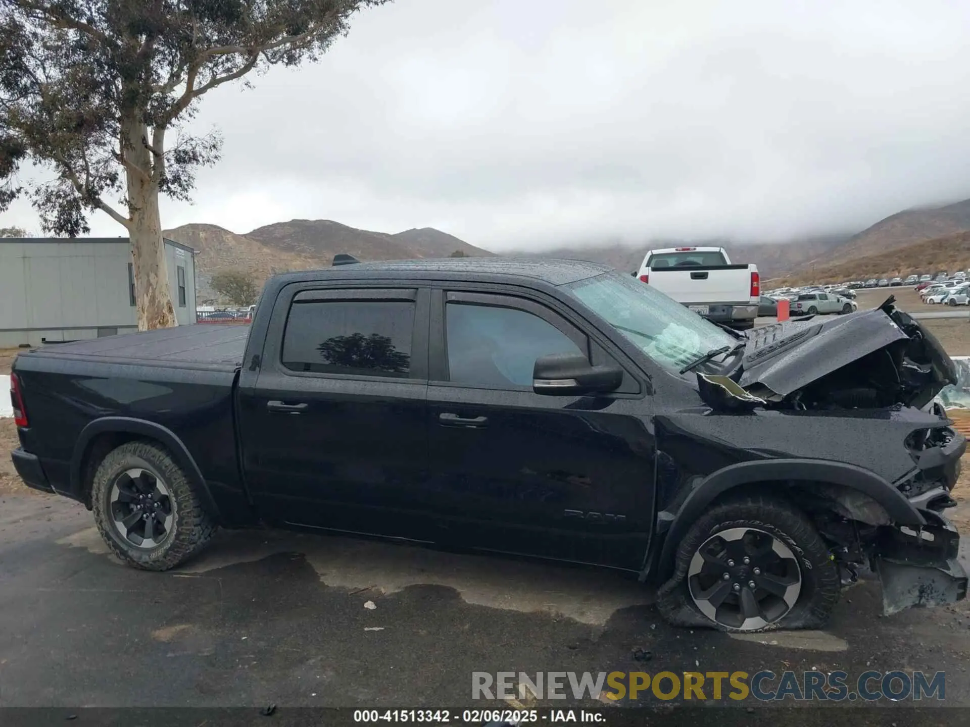 14 Photograph of a damaged car 1C6SRFLT0MN614070 RAM 1500 2021