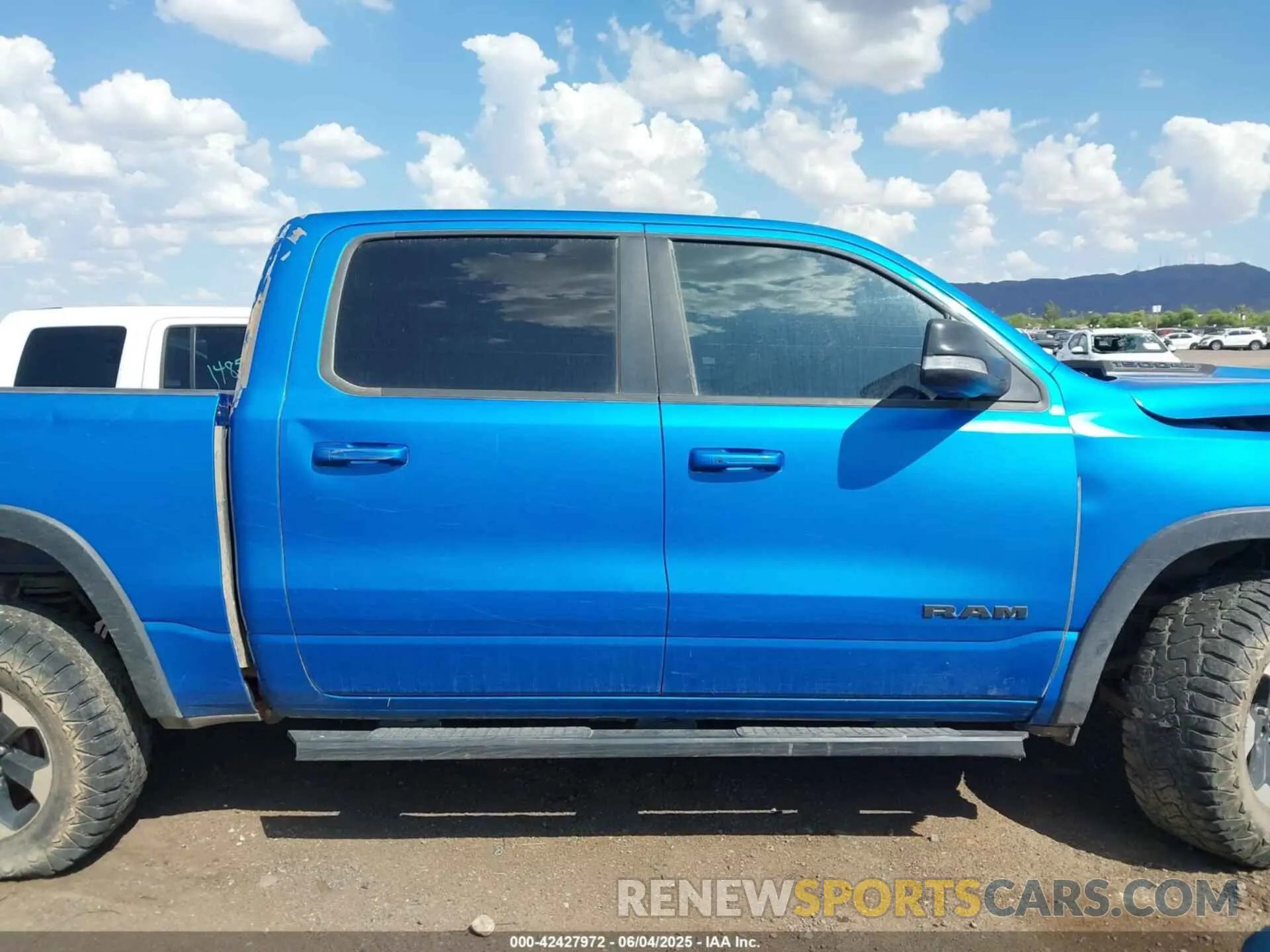 12 Photograph of a damaged car 1C6SRFLT3MN573143 RAM 1500 2021