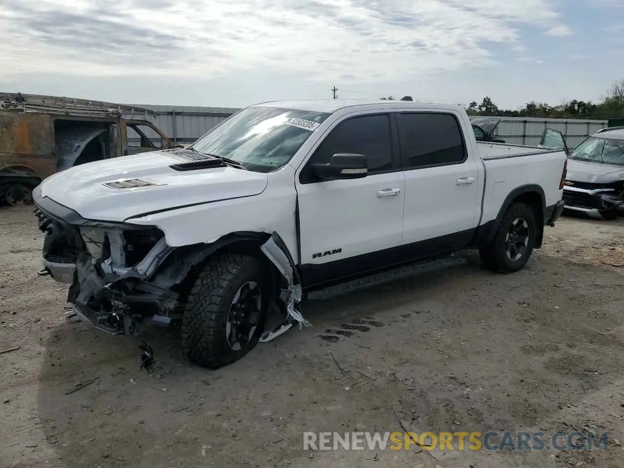 1 Photograph of a damaged car 1C6SRFLT4MN721557 RAM 1500 2021