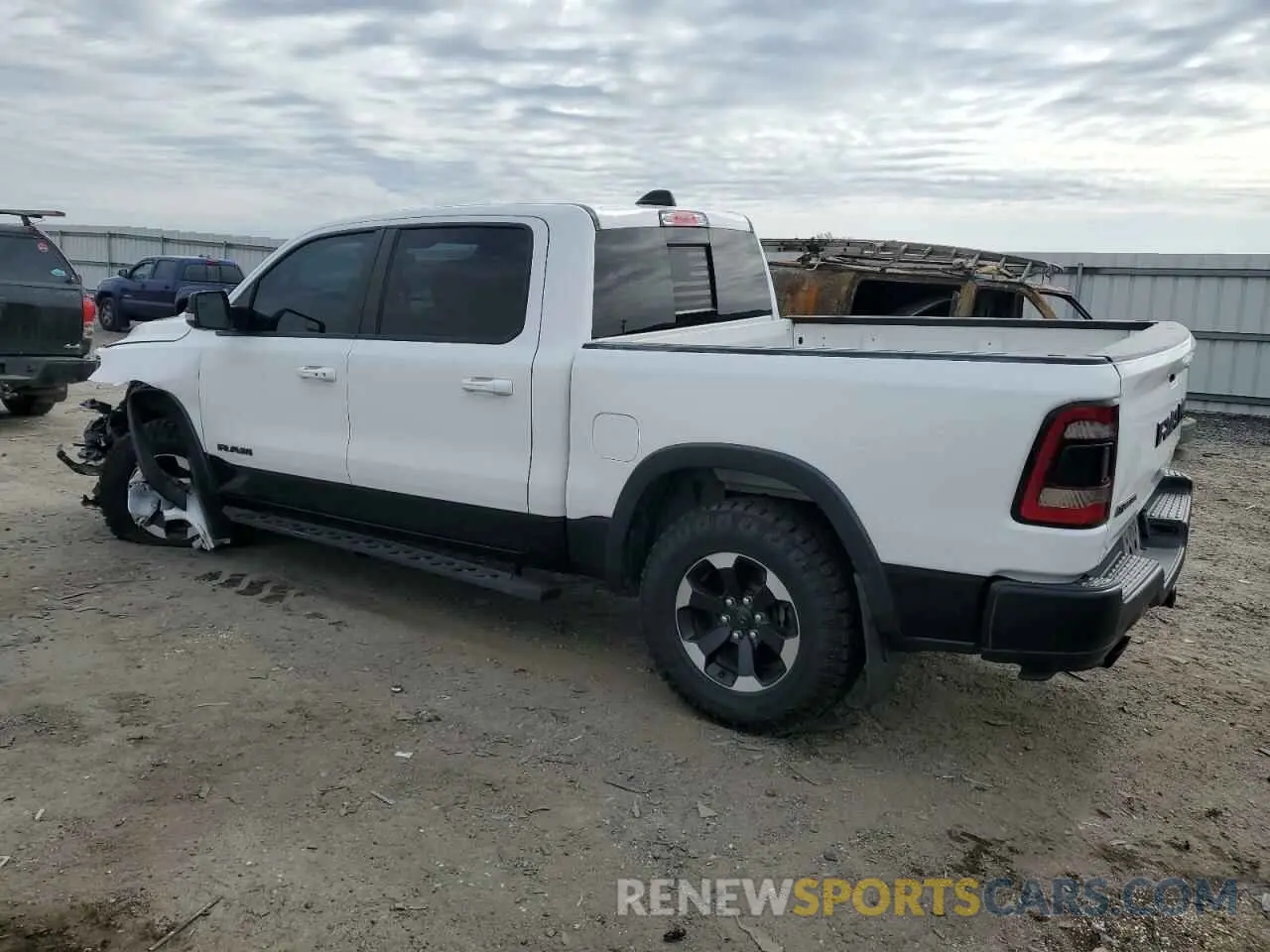 2 Photograph of a damaged car 1C6SRFLT4MN721557 RAM 1500 2021