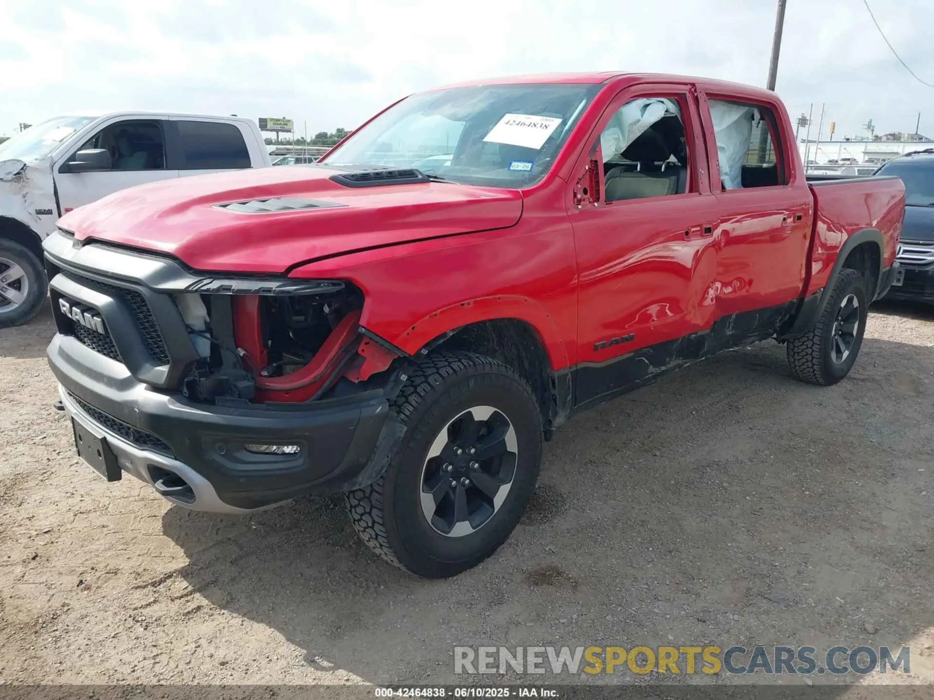 2 Photograph of a damaged car 1C6SRFLT8MN595963 RAM 1500 2021