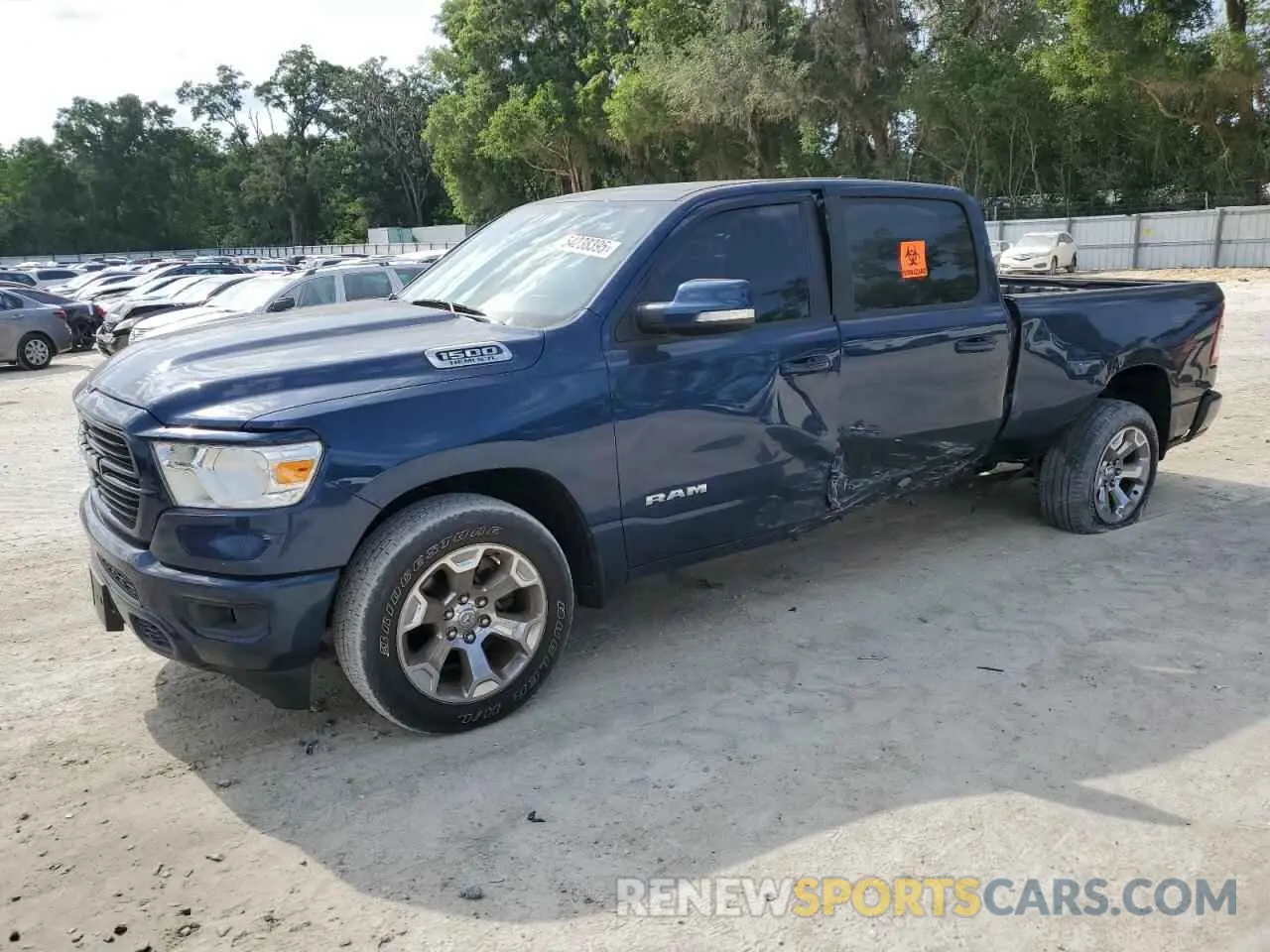 1 Photograph of a damaged car 1C6SRFMT0MN725619 RAM 1500 2021