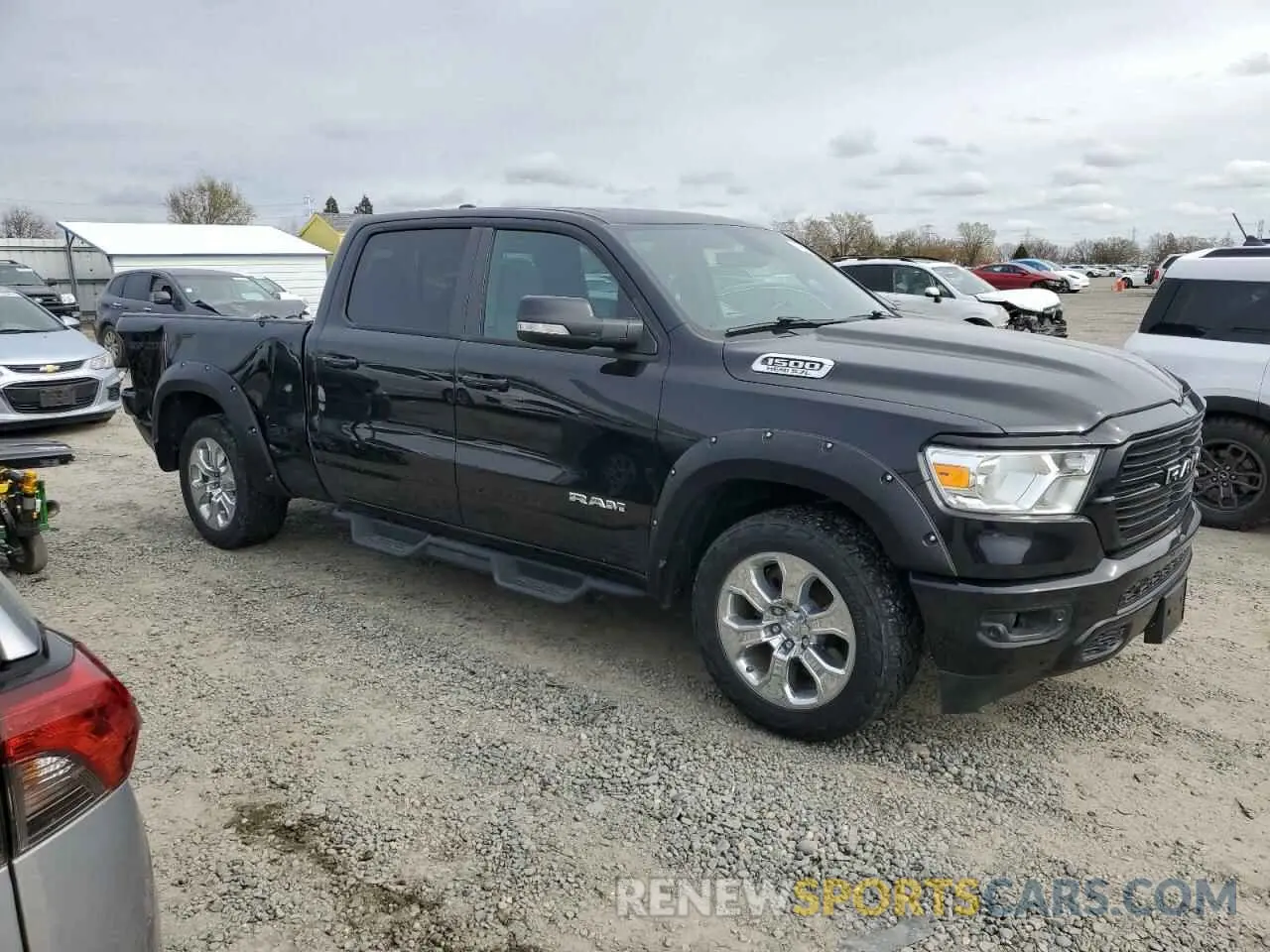 4 Photograph of a damaged car 1C6SRFMT2MN549057 RAM 1500 2021