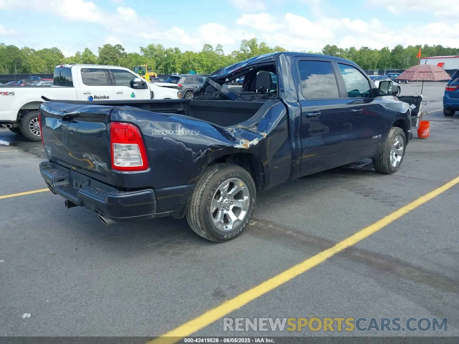 4 Photograph of a damaged car 1C6SRFMT4MN663514 RAM 1500 2021