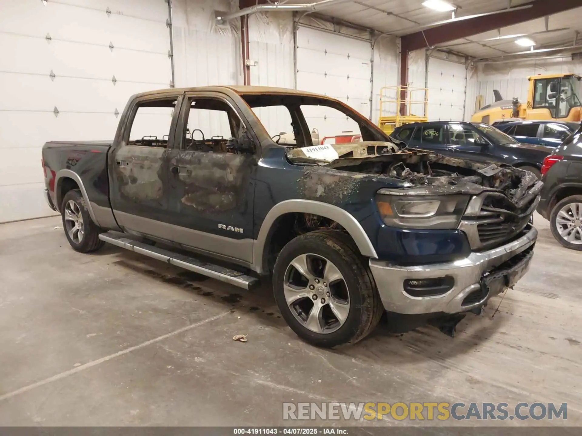 1 Photograph of a damaged car 1C6SRFRT4MN834741 RAM 1500 2021