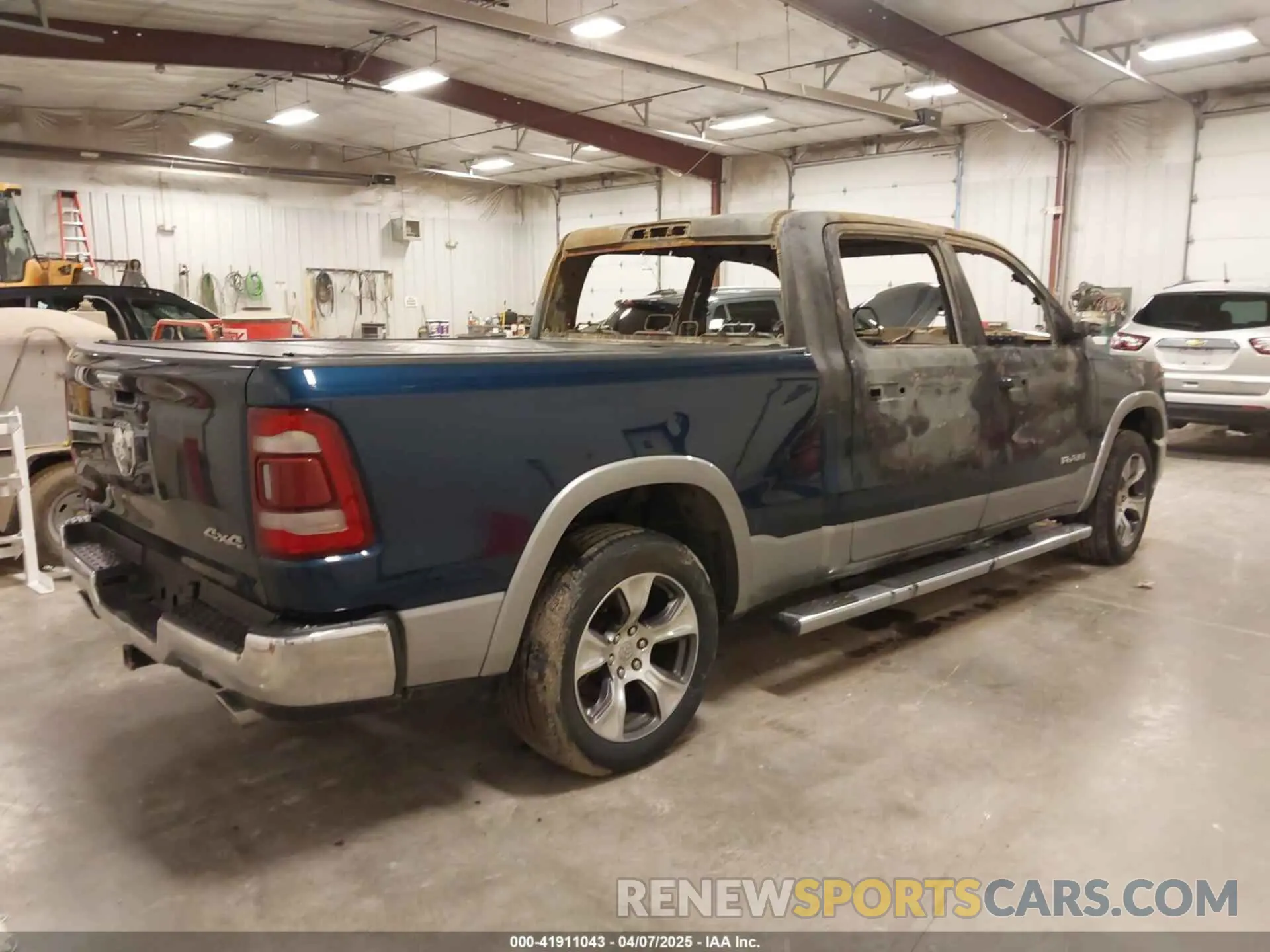 4 Photograph of a damaged car 1C6SRFRT4MN834741 RAM 1500 2021
