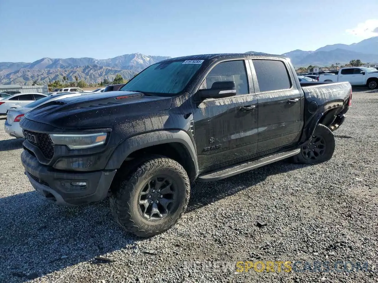 1 Photograph of a damaged car 1C6SRFU91MN723933 RAM 1500 2021