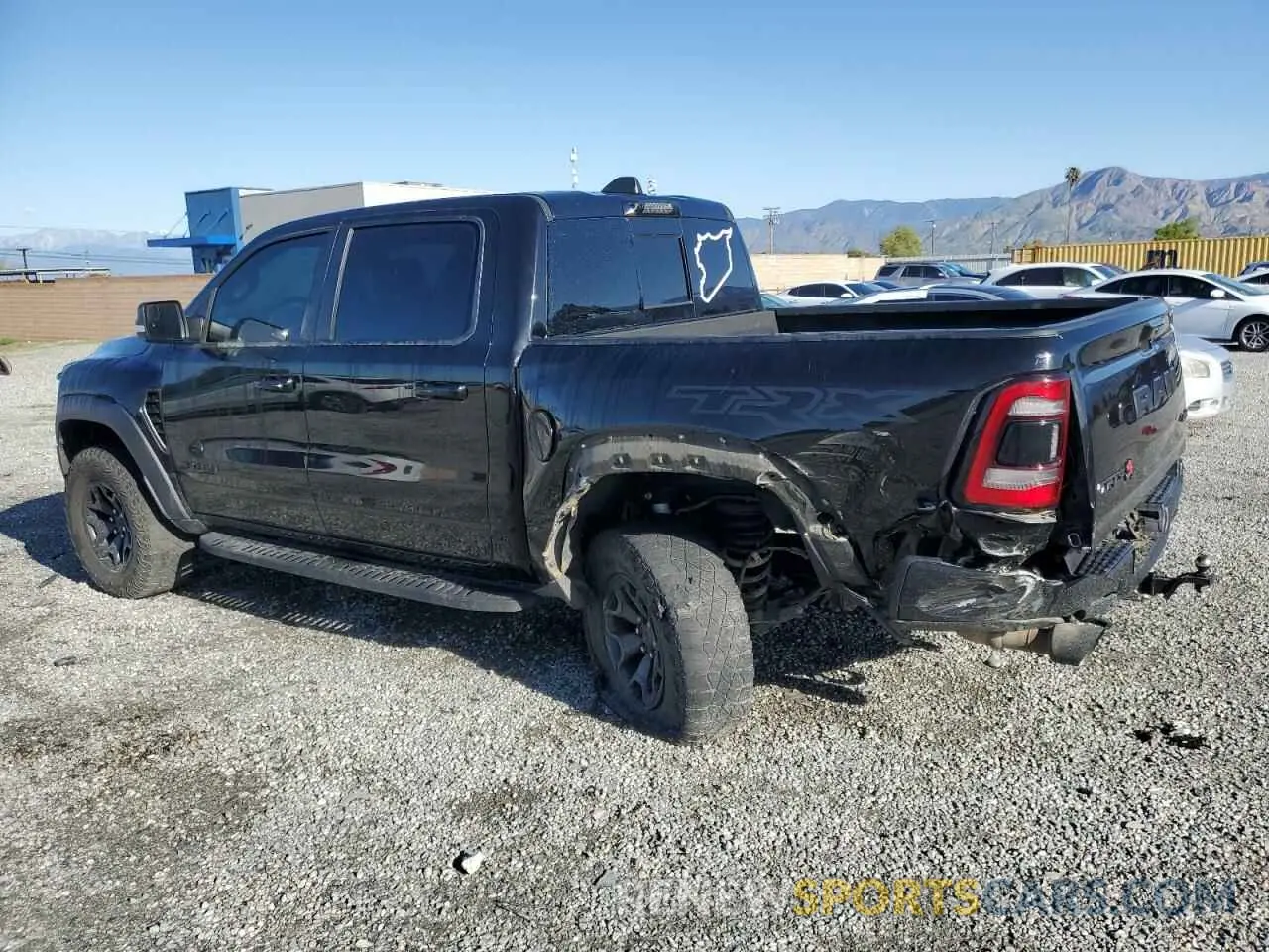 2 Photograph of a damaged car 1C6SRFU91MN723933 RAM 1500 2021