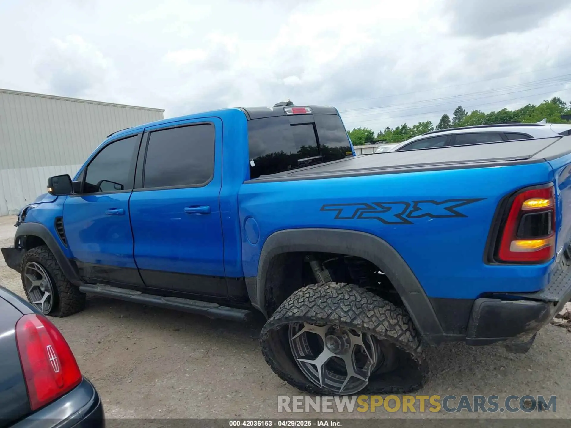 14 Photograph of a damaged car 1C6SRFU91MN903851 RAM 1500 2021