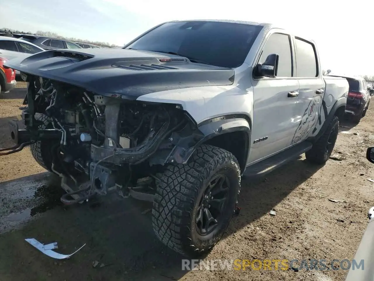 1 Photograph of a damaged car 1C6SRFU97MN791556 RAM 1500 2021