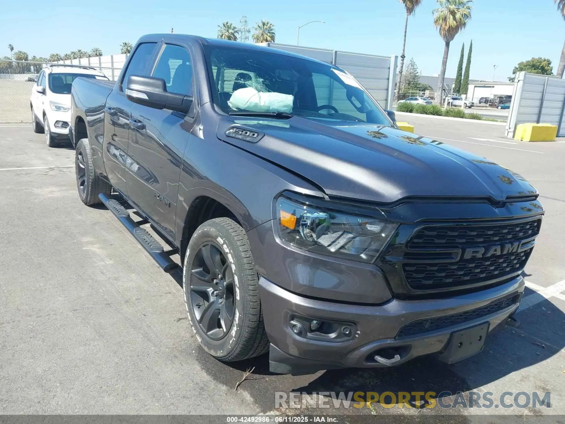 1 Photograph of a damaged car 1C6SRFBT3NN184201 RAM 1500 2022