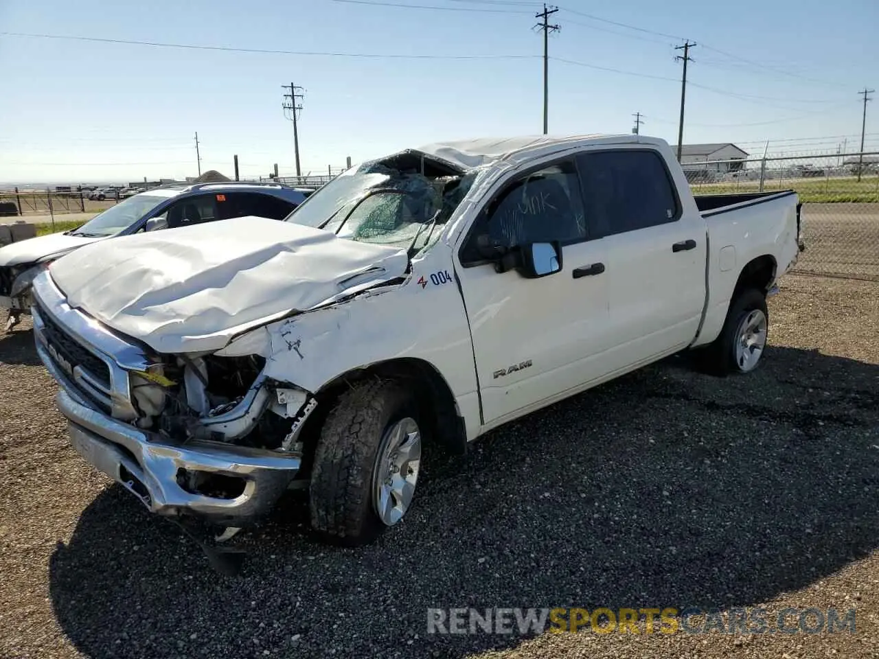 1 Photograph of a damaged car 1C6SRFGTXNN228686 RAM 1500 2022