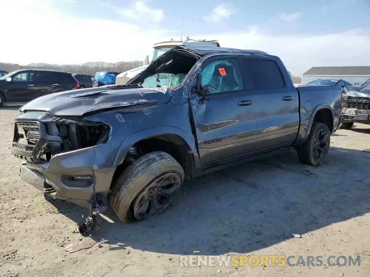 1 Photograph of a damaged car 1C6SRFHT0NN281976 RAM 1500 2022