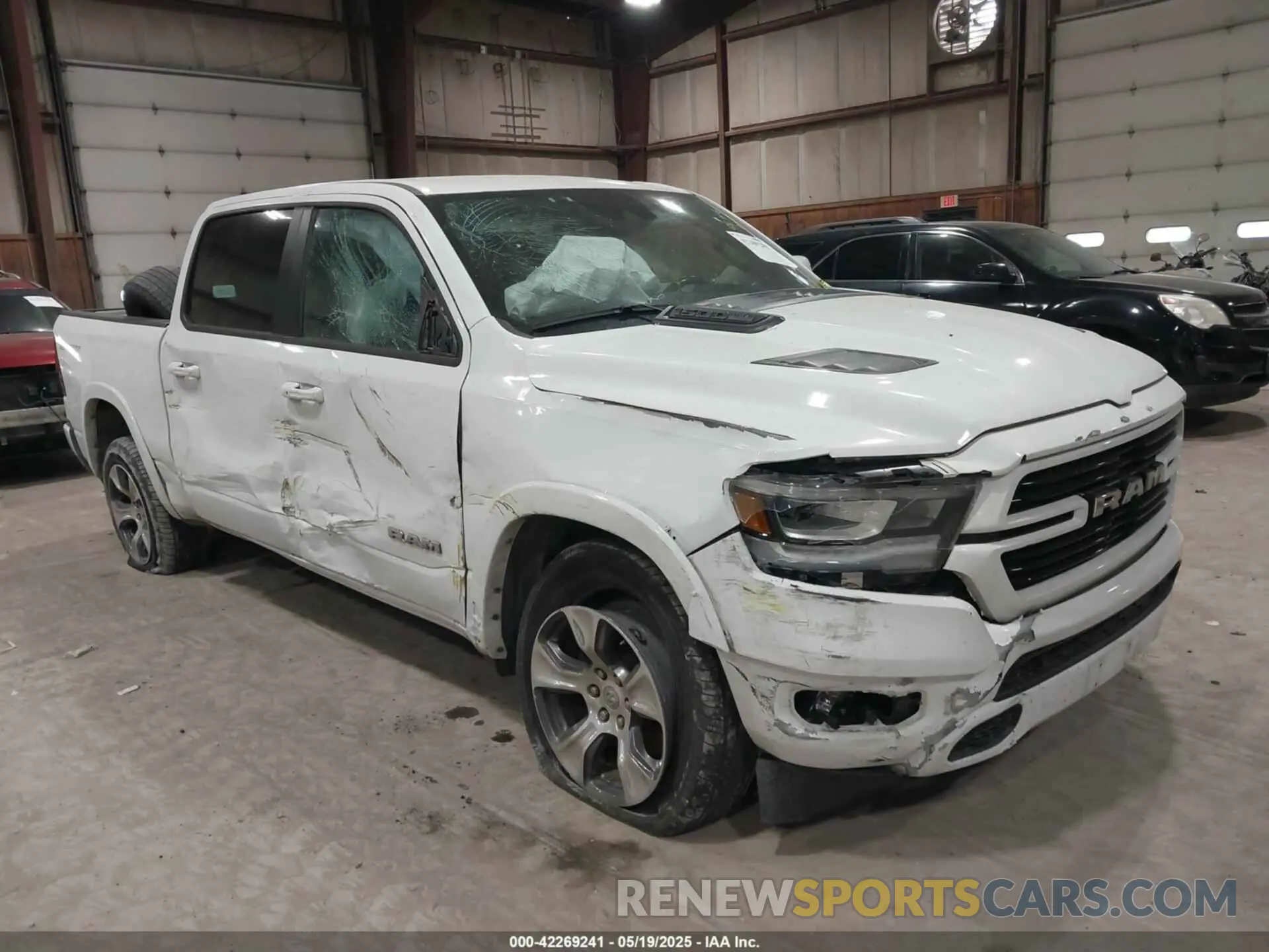 1 Photograph of a damaged car 1C6SRFJTXNN222654 RAM 1500 2022