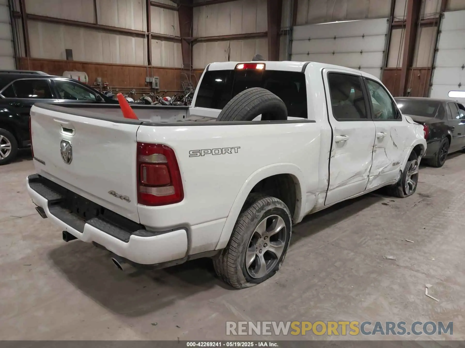 4 Photograph of a damaged car 1C6SRFJTXNN222654 RAM 1500 2022
