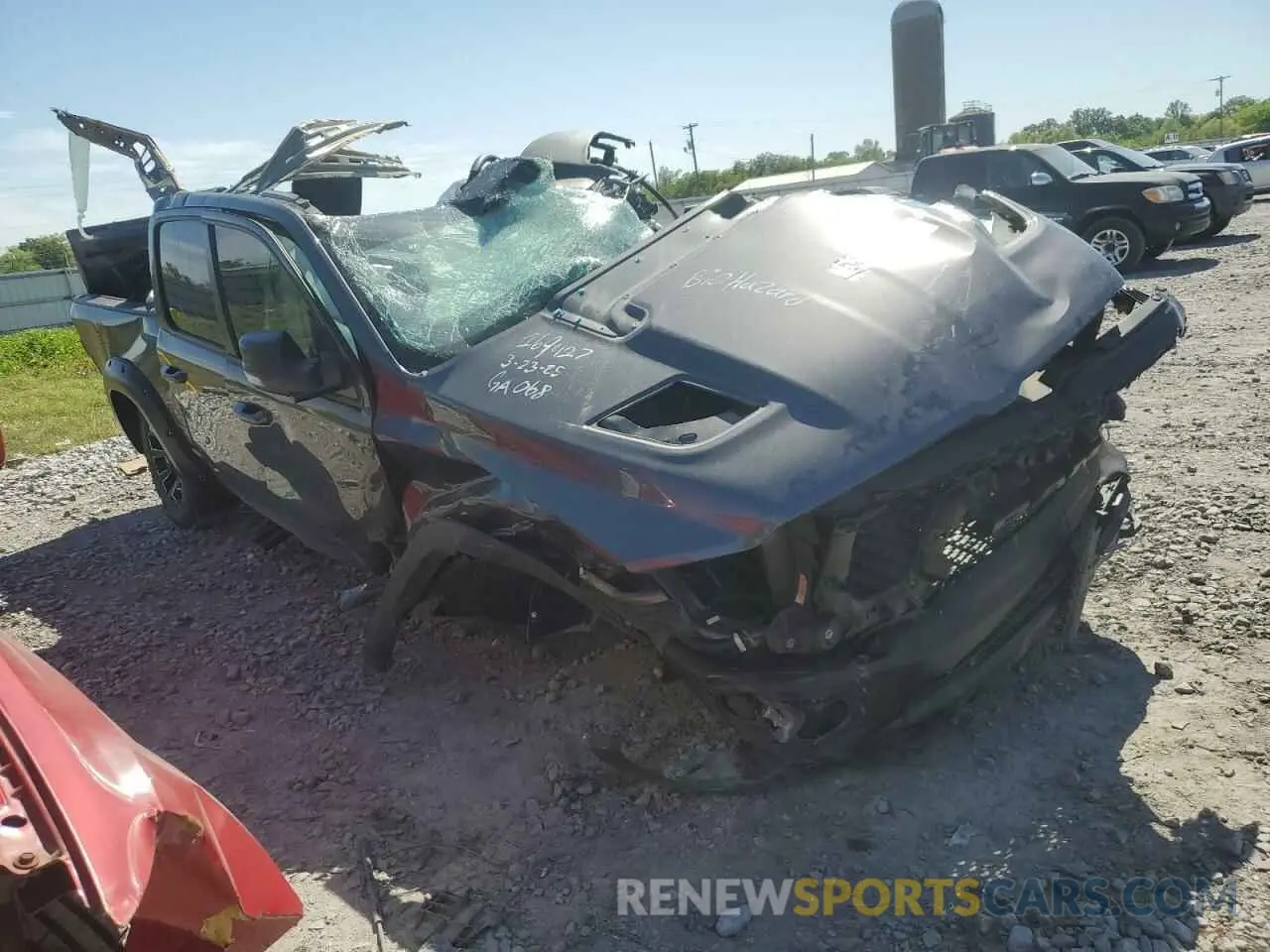4 Photograph of a damaged car 1C6SRFLT1NN112993 RAM 1500 2022