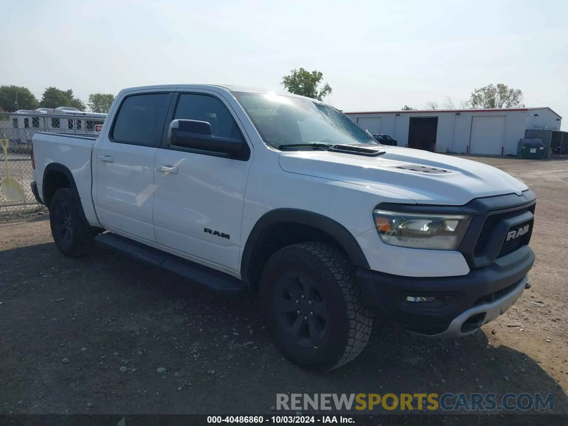 1 Photograph of a damaged car 1C6SRFLTXNN338532 RAM 1500 2022