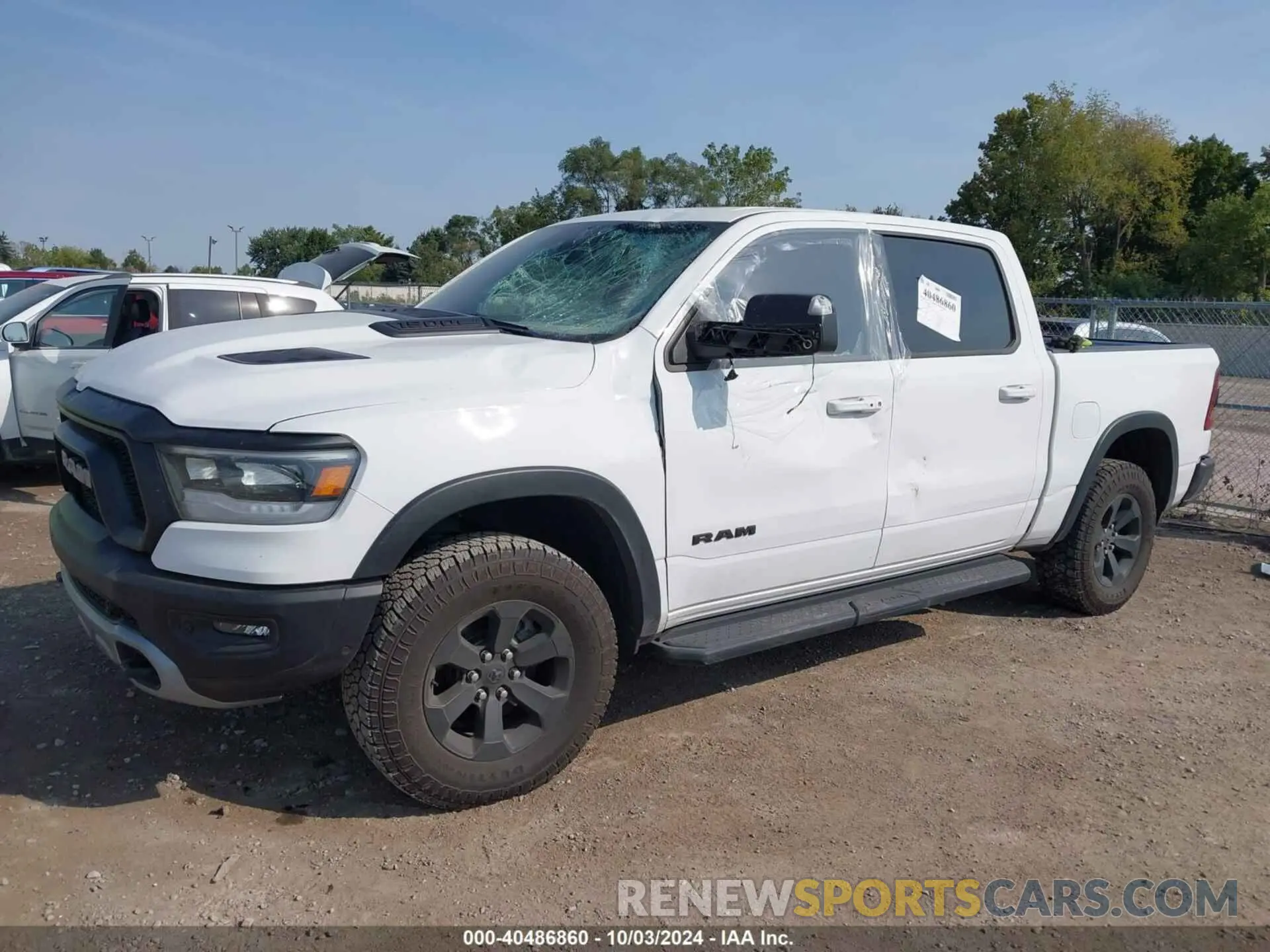 2 Photograph of a damaged car 1C6SRFLTXNN338532 RAM 1500 2022