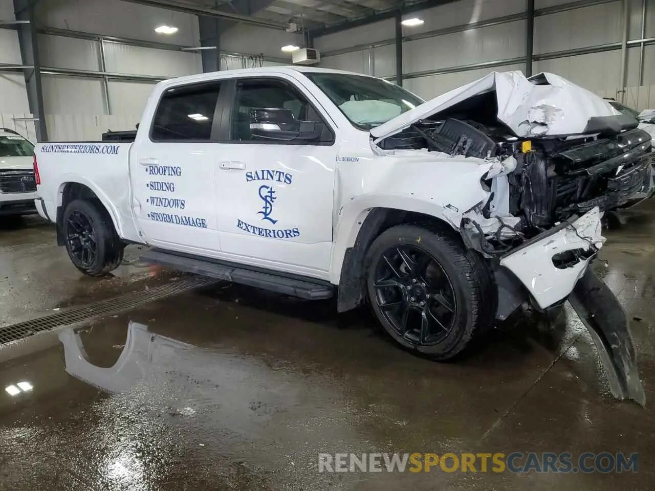 4 Photograph of a damaged car 1C6SRFRT9NN387423 RAM 1500 2022