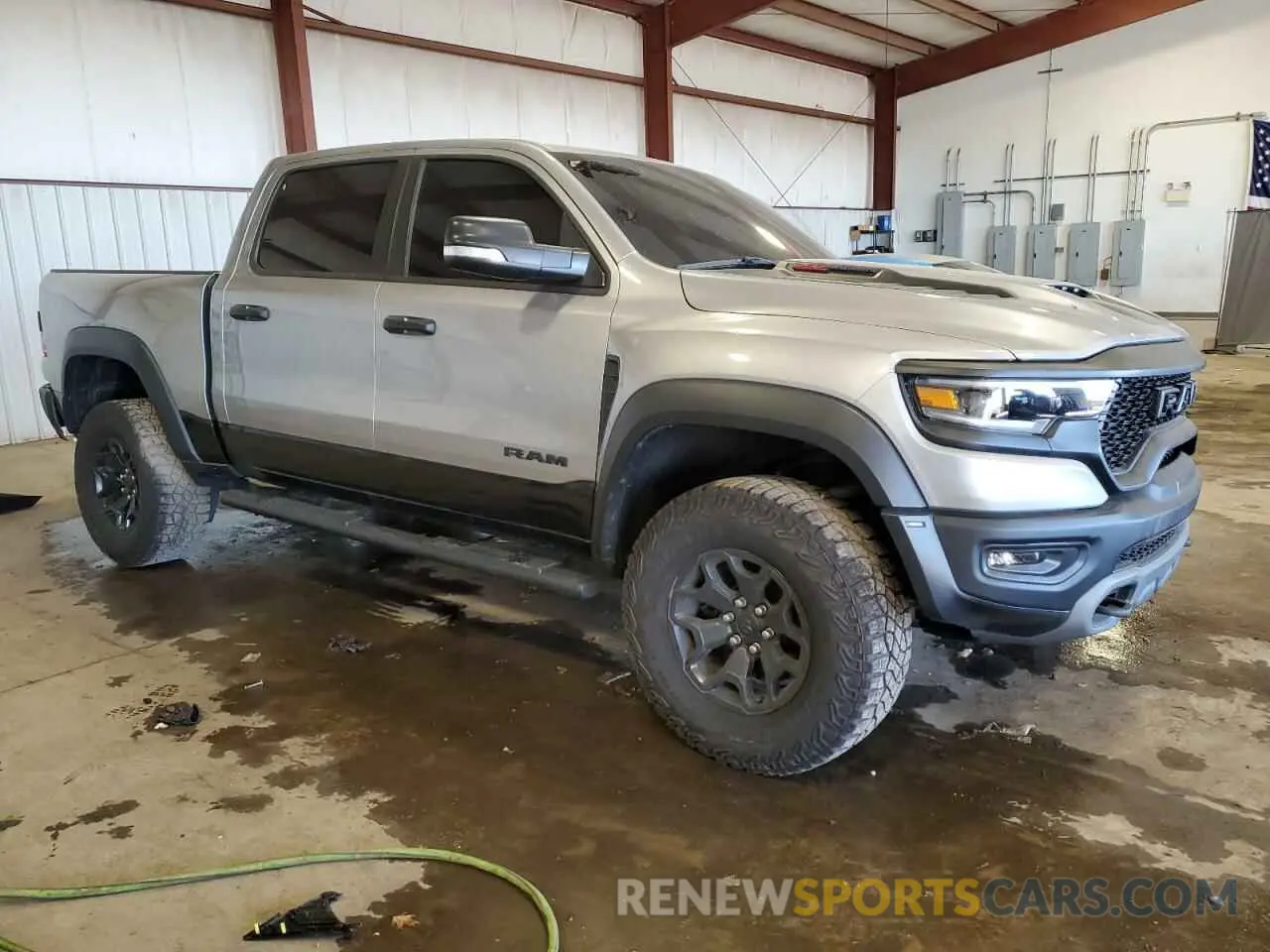 4 Photograph of a damaged car 1C6SRFU97NN403064 RAM 1500 2022