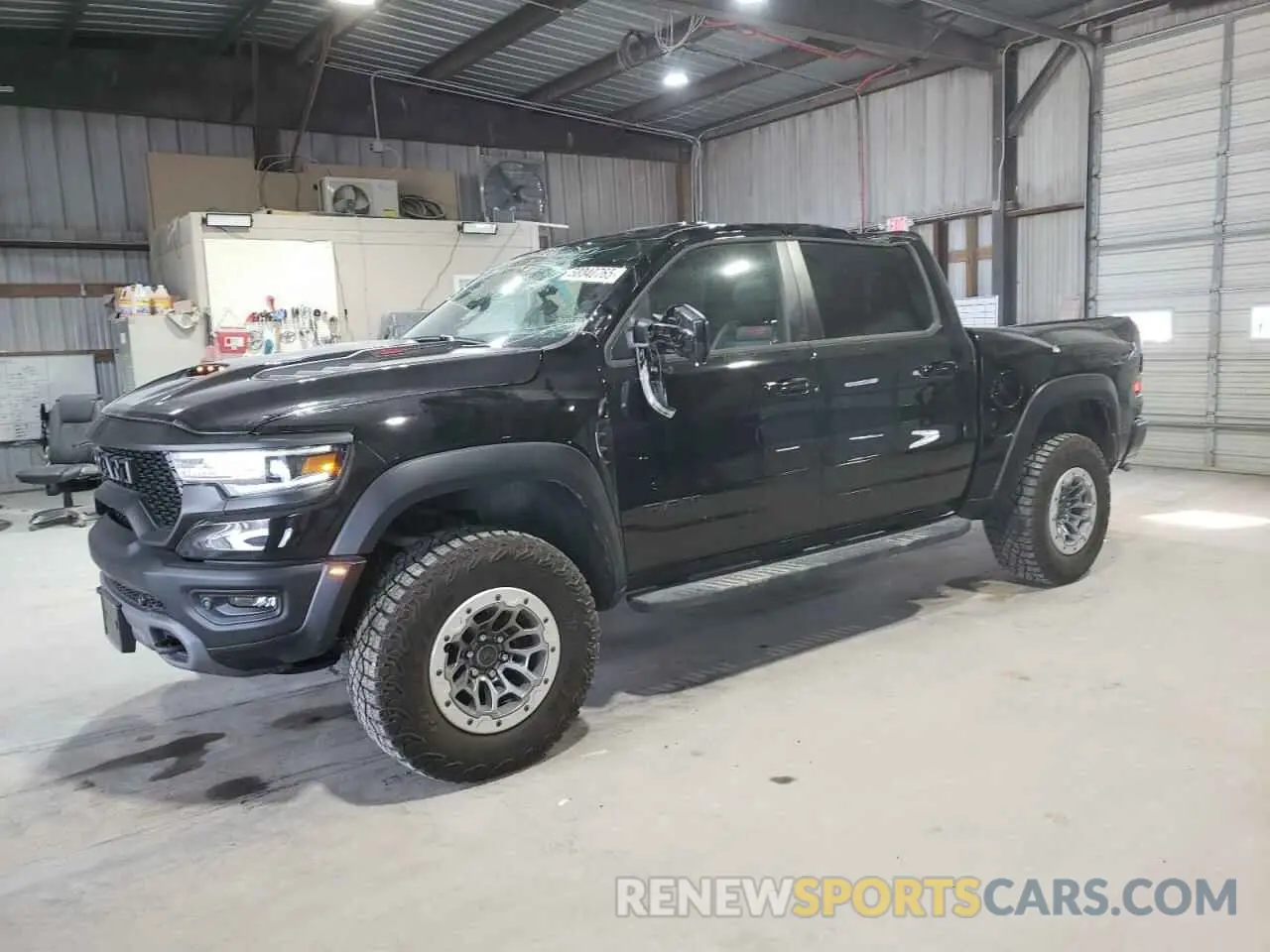 1 Photograph of a damaged car 1C6SRFU99NN320249 RAM 1500 2022